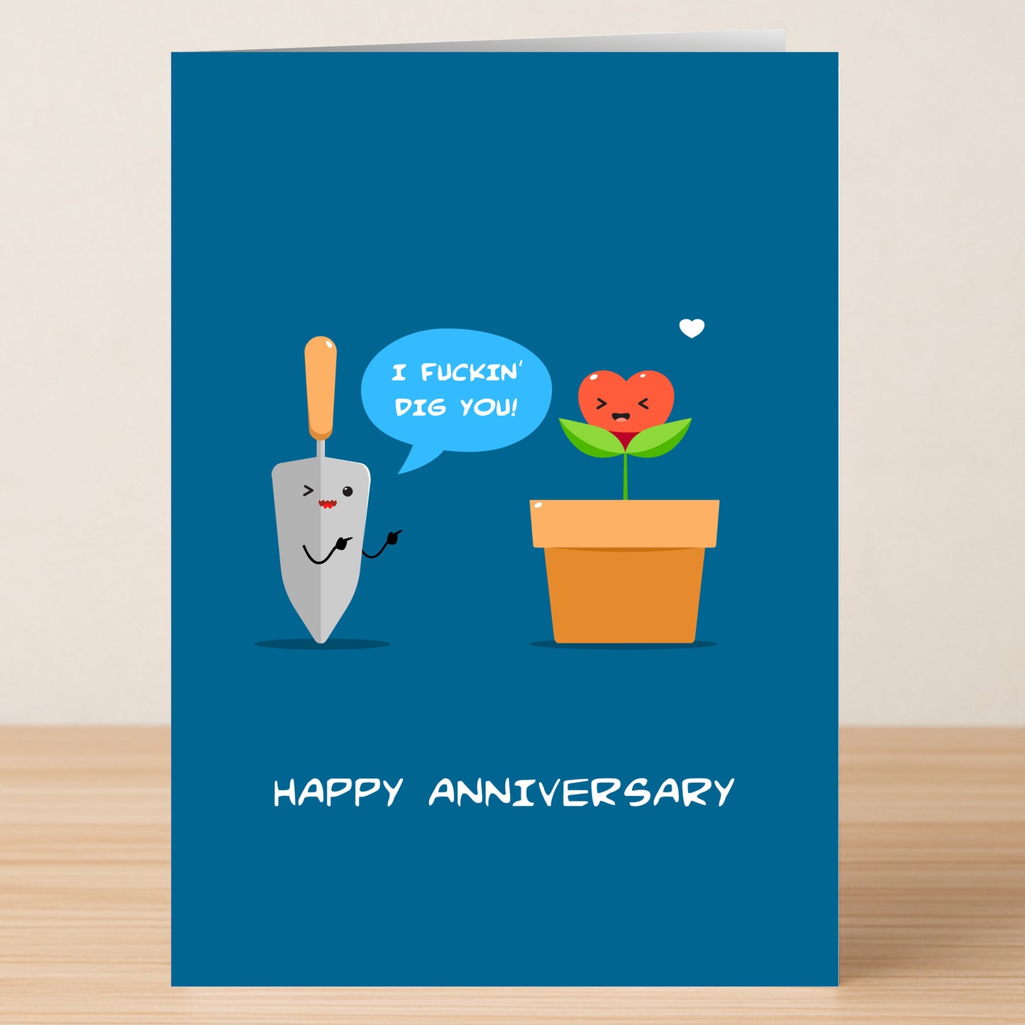 The Dig You Funny Anniversary Card by Twisted Gifts features a cartoon trowel saying "I fuckin' dig you!" to a blushing potted plant with a heart-shaped flower and "HAPPY ANNIVERSARY" text—perfect for celebrating love with humor.