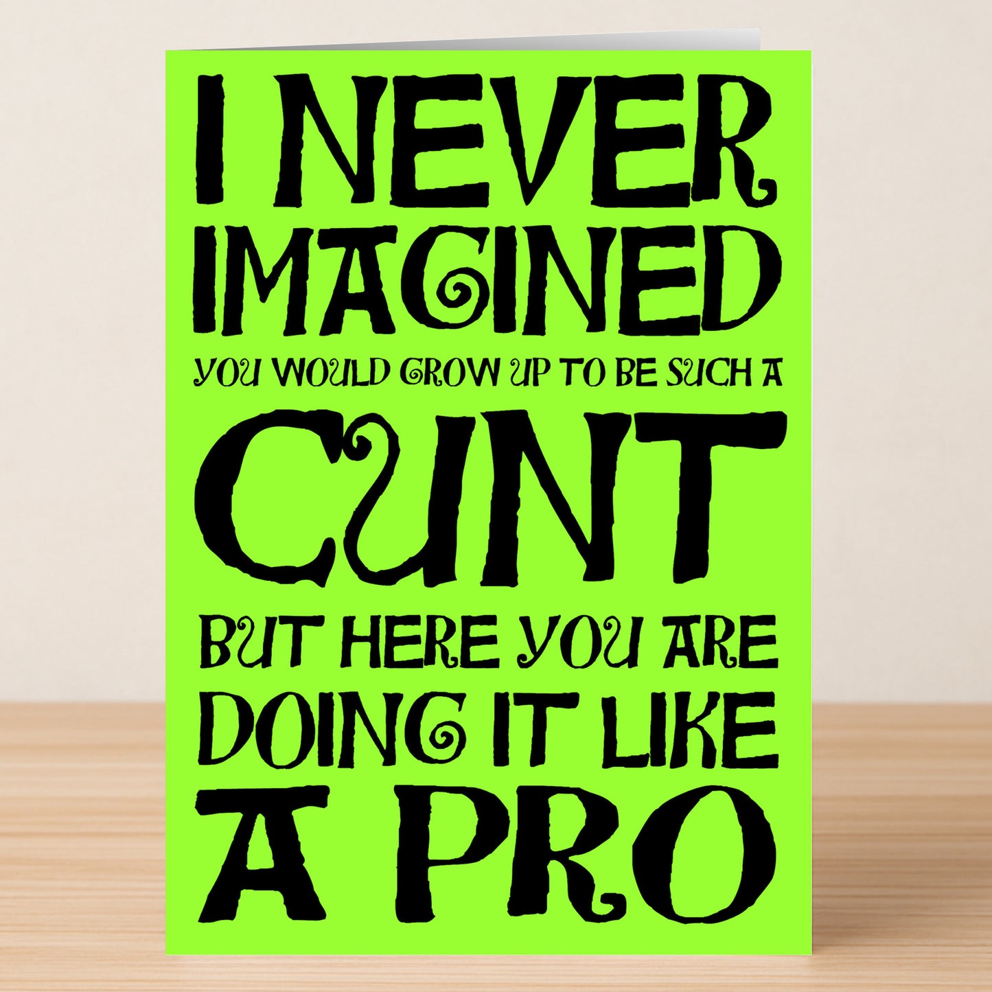 The Like A Pro Insulting Greeting Card by Twisted Gifts features bold black text on bright green and delivers sharp, sarcastic humor—ideal for anyone who loves funny, insulting cards.