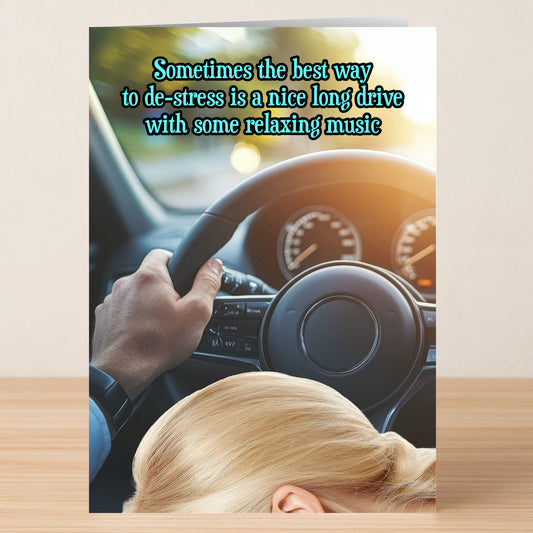 Send the Twisted Gifts "Long Drive, Rude Greeting Card"—featuring a driver with one hand on the wheel, sunlight behind them, and a cheeky message about de-stressing with music. Perfect for sharing humor and charm!.