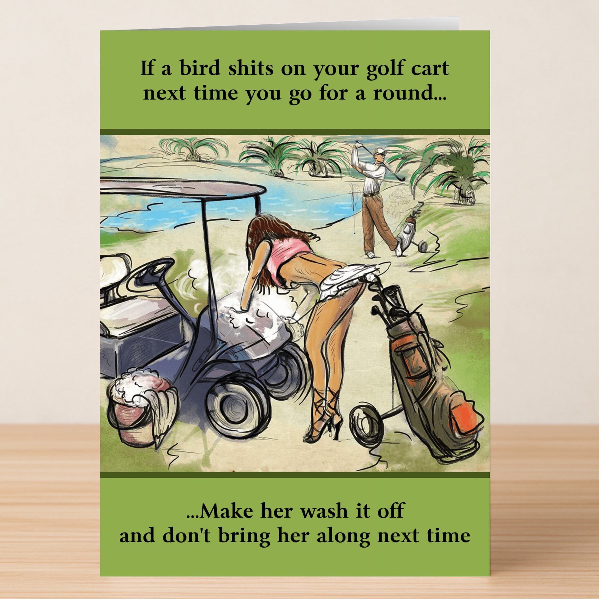 The Golf Cart Funny Greeting Card by Twisted Gifts features golf humor—a woman cleans a soiled cart while a man plays, with funny text about not bringing her next time after a bird mess incident.