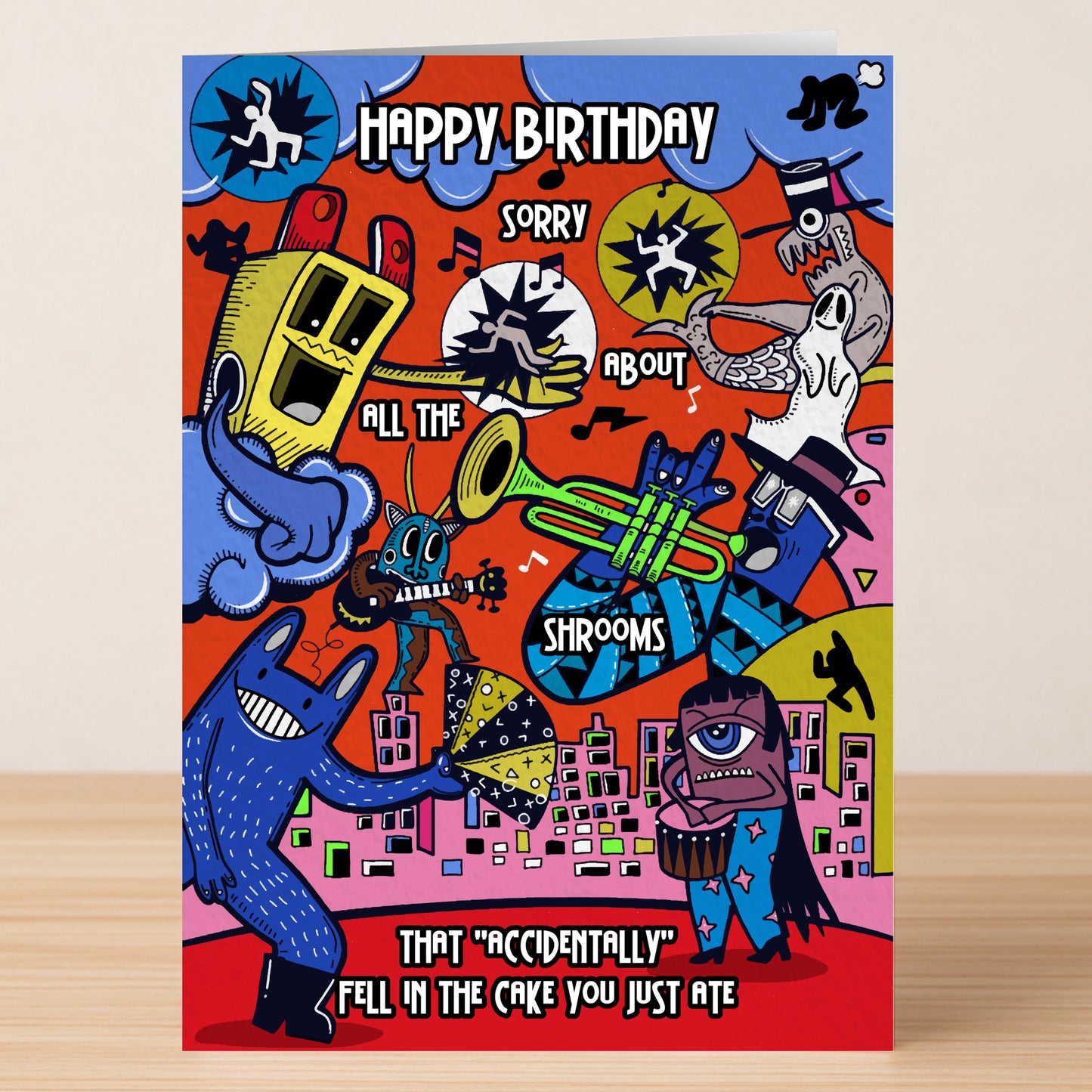 The All The Shrooms Funny Birthday Card by Twisted Gifts features colorful, cartoon characters with witty jokes and the text: “Happy Birthday. Sorry about all the shrooms that 'accidentally' fell in the cake you just ate.” Ideal for mushroom lovers!.
