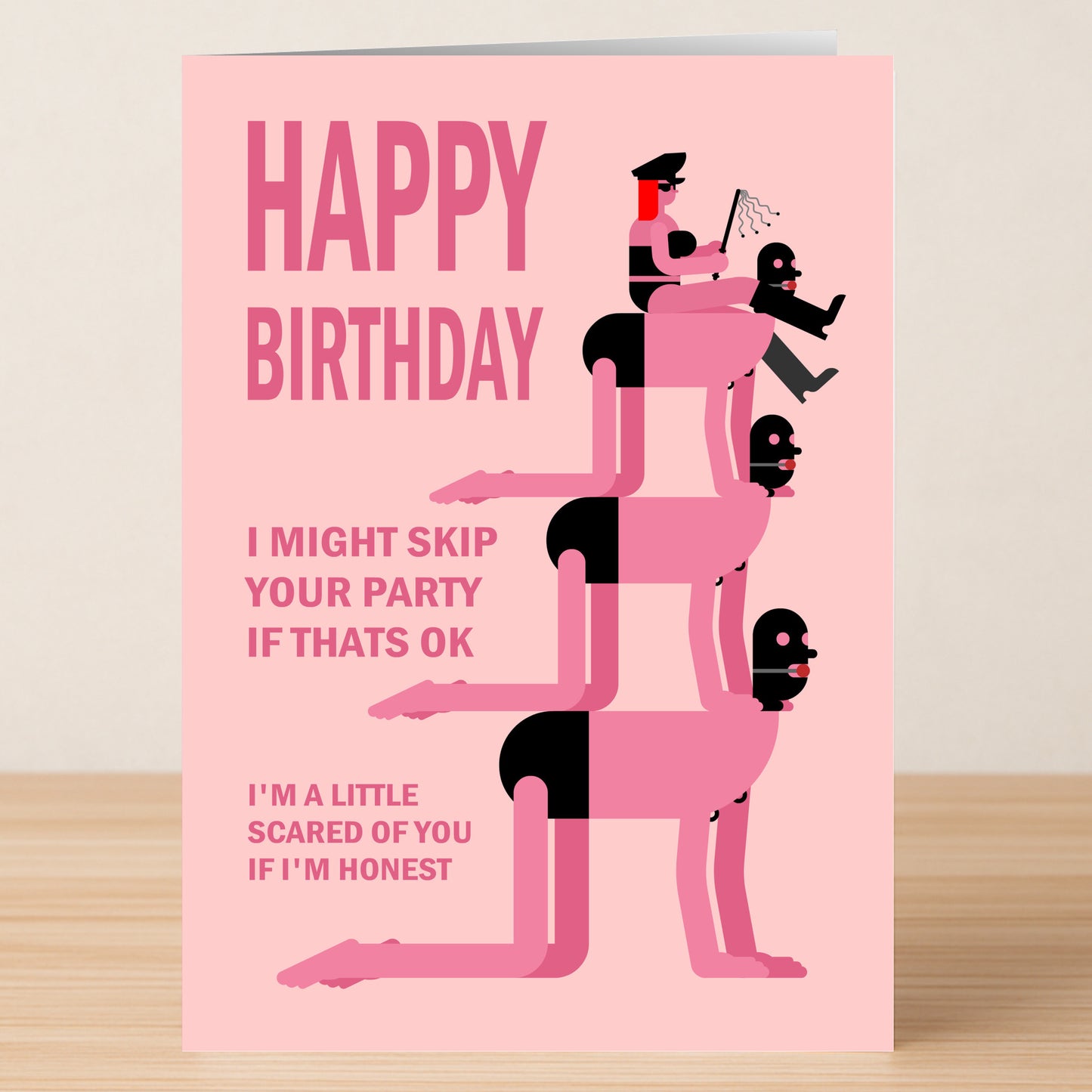 The "A Little Scared Rude Birthday Card" by Twisted Gifts is a pink card with three masked figures stacked on all fours and a figure in black holding a whip, plus bold "HAPPY BIRTHDAY" text and a funny message.