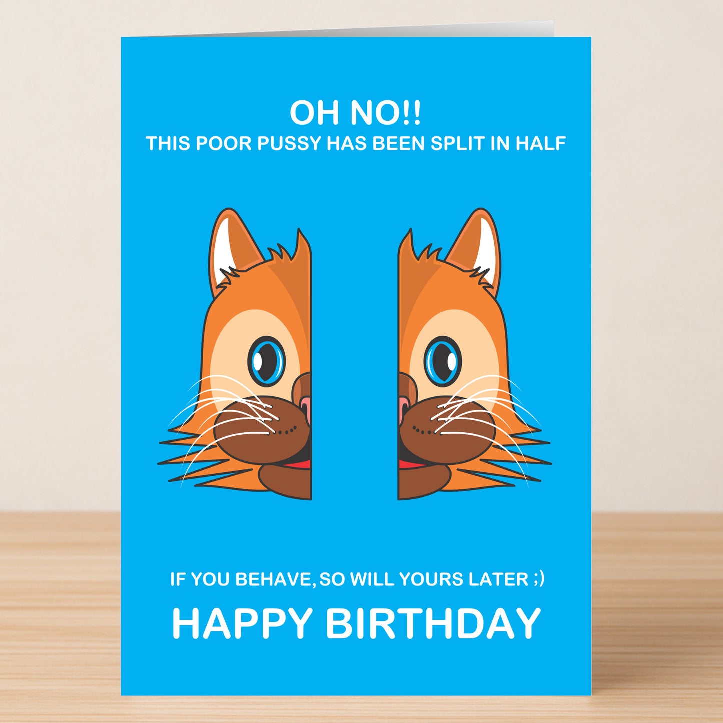 The Split In Half Rude Birthday Card by Twisted Gifts features a cartoon cat's face split in half and the funny message: "OH NO!! THIS POOR PUSSY HAS BEEN SPLIT IN HALF... HAPPY BIRTHDAY." Ideal for anyone with a crude sense of humor!.