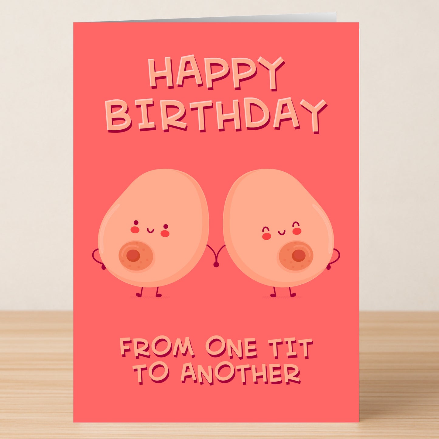 The One Tit Funny Birthday Card by Twisted Gifts features two cartoon breasts holding hands with the text "HAPPY BIRTHDAY FROM ONE TIT TO ANOTHER." A hilarious pink birthday card for anyone who loves a good laugh!.
