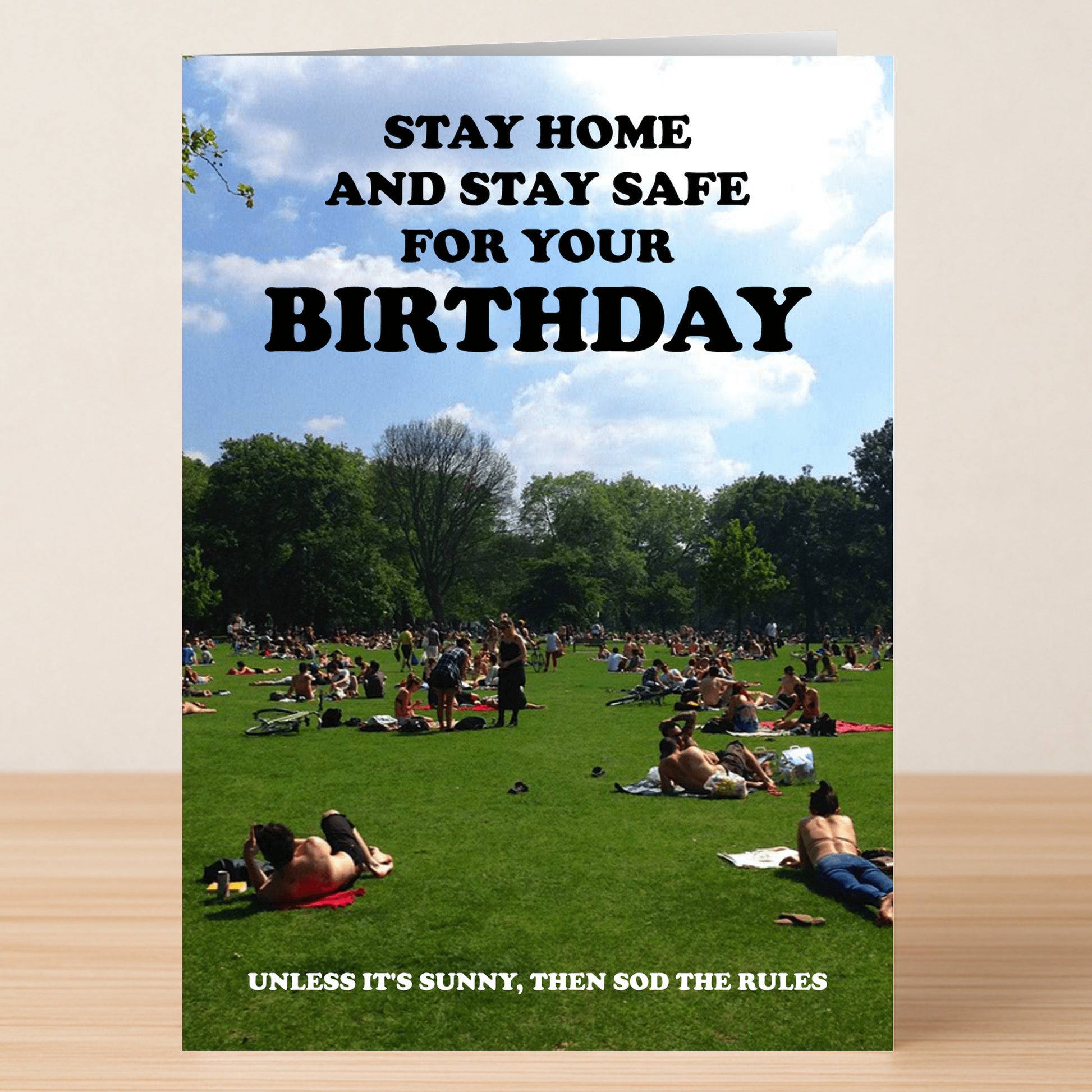 The Rules Funny Birthday Card by Twisted Gifts shows a crowded park with sunbathers and reads: "Stay home and stay safe for your birthday, unless it's sunny, then sod the rules.