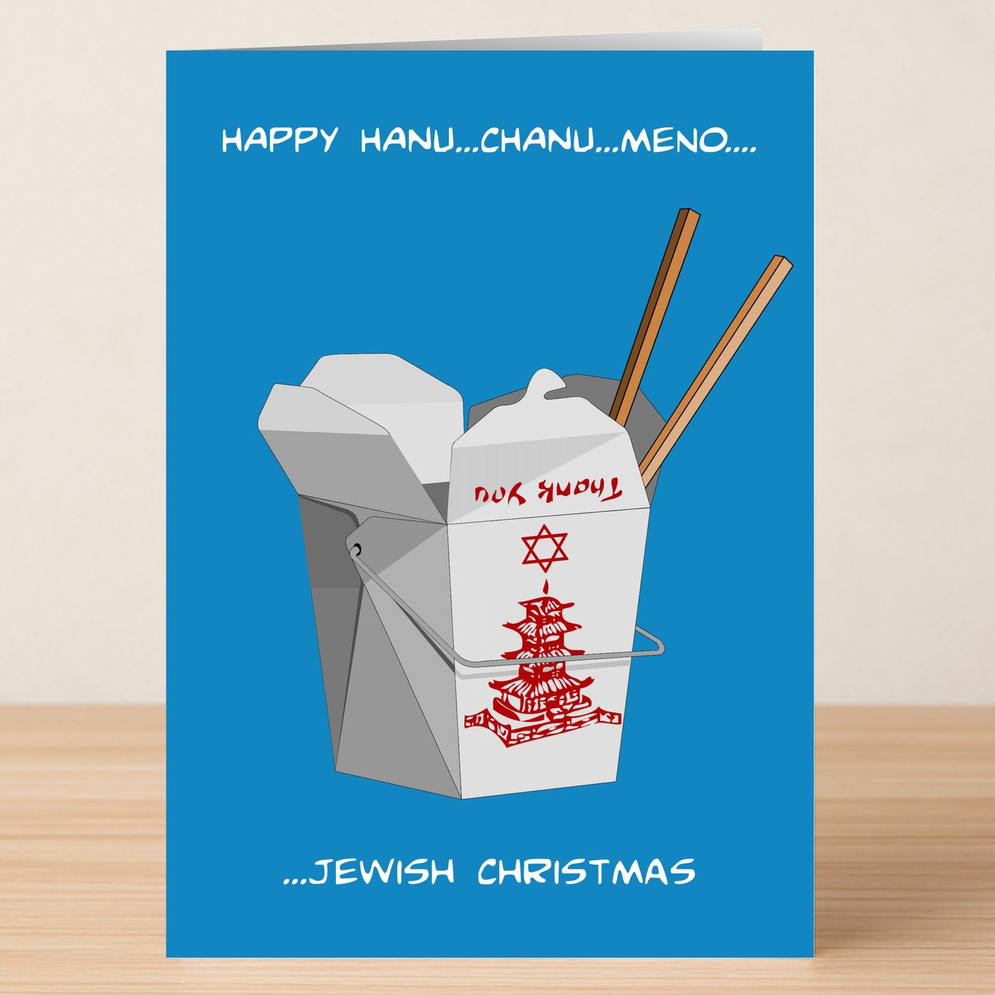 The Hanu Chanu Funny Christmas Card by Twisted Gifts features a Chinese takeout box and chopsticks with the text "Happy Hanu...Chanu...Meno...Jewish Christmas" on blue—a humorous way to spread holiday cheer.