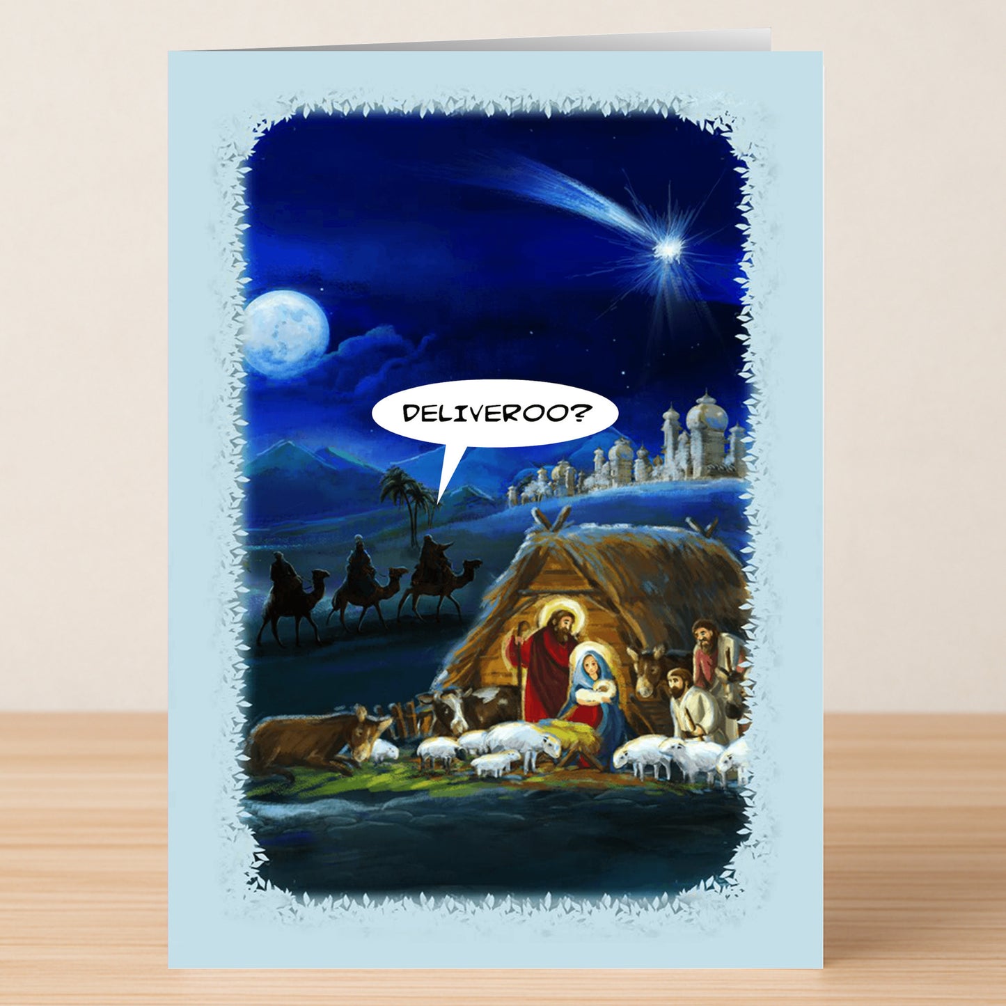 The Deliveroo Funny Christmas Card by Twisted Gifts features baby Jesus in a nativity scene saying "DELIVEROO?" with three wise men and a star—perfect for adding humor to the holiday season.