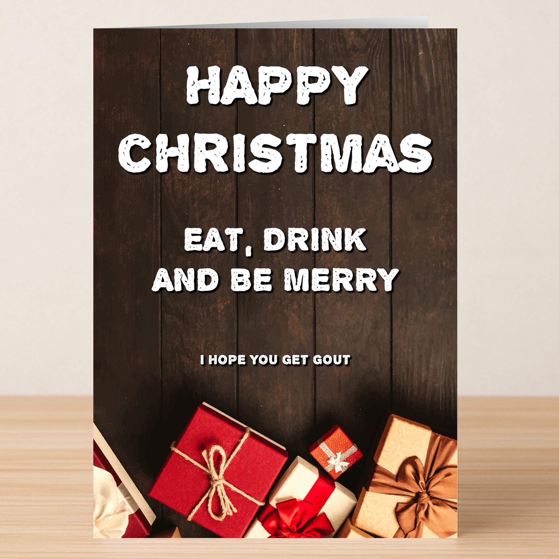 Spread holiday cheer with the Gout Funny Christmas Card by Twisted Gifts—featuring “Happy Christmas. Eat, Drink and Be Merry. I hope you get gout” and festive gift boxes—perfect for gifting laughter this season!.