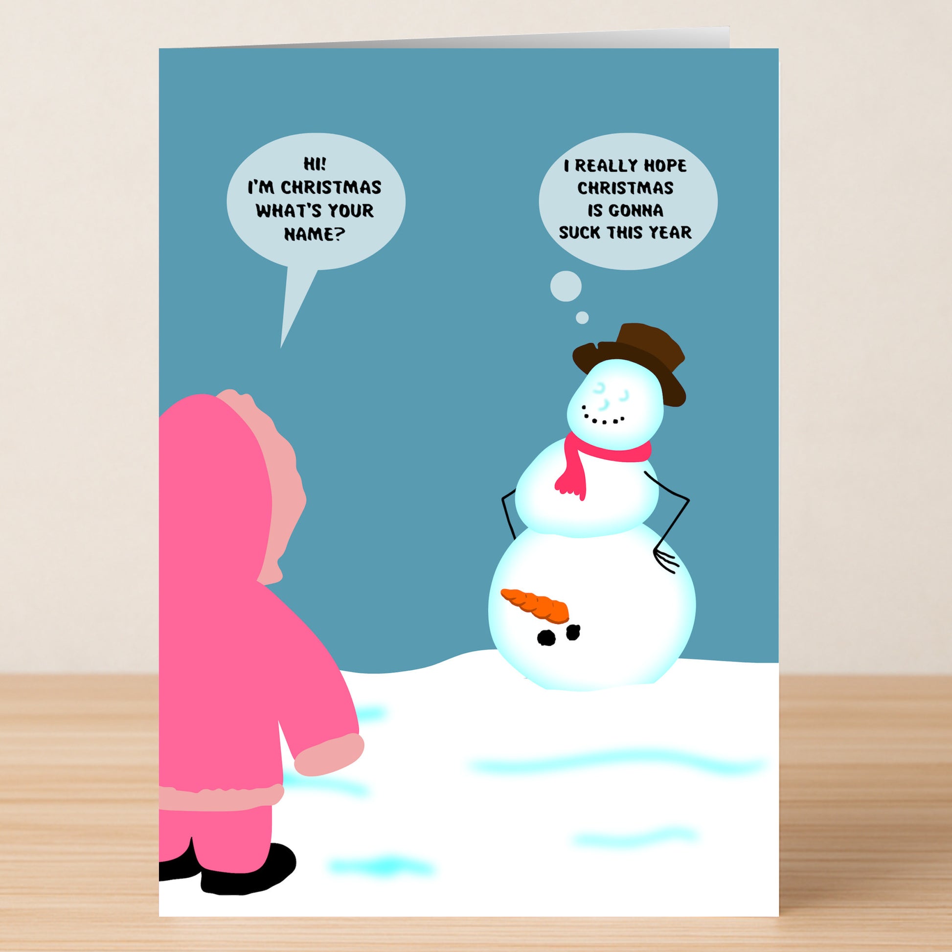 The Twisted Gifts Christmas Sucks Rude Christmas Card features a child in a pink coat talking to a snowman, with speech bubbles reading “Hi! I’m Christmas. What’s your name?” and “I really hope Christmas Sucks this year.” Perfect for unconventional holiday greetings.