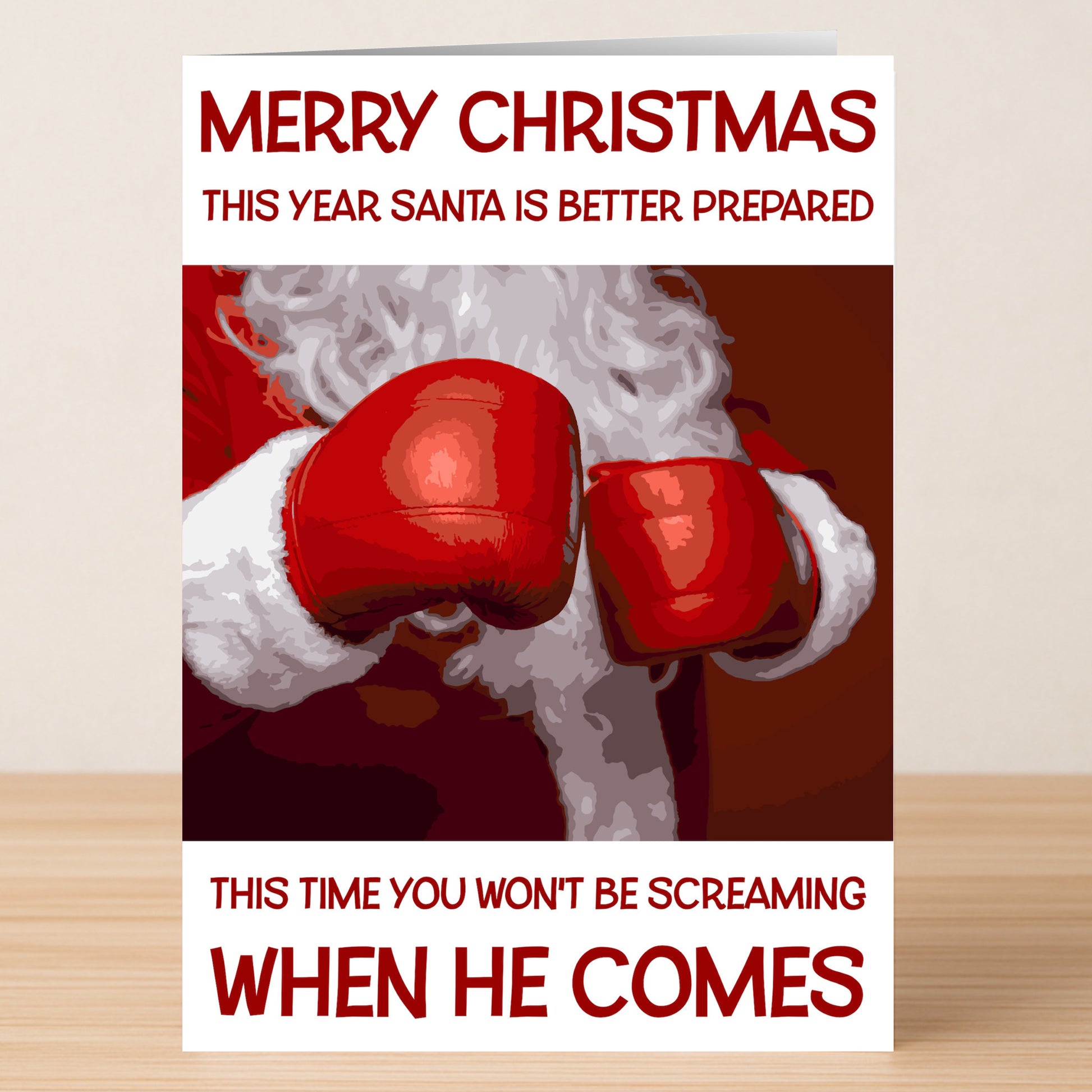 The Better Prepared Funny Christmas Card by Twisted Gifts features Santa with red boxing gloves and cheeky text, making it a perfect choice for spreading holiday cheer with humor.