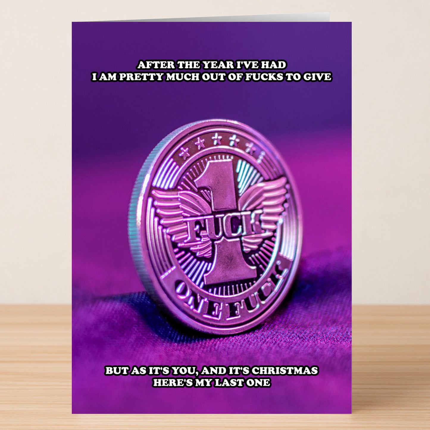 Send some holiday laughs with Twisted Gifts' Fucks To Give Funny Christmas Card. It features a big "1 Fuck" coin on purple and the message: "After the year I've had I am pretty much out of fucks to give...here's my last one.