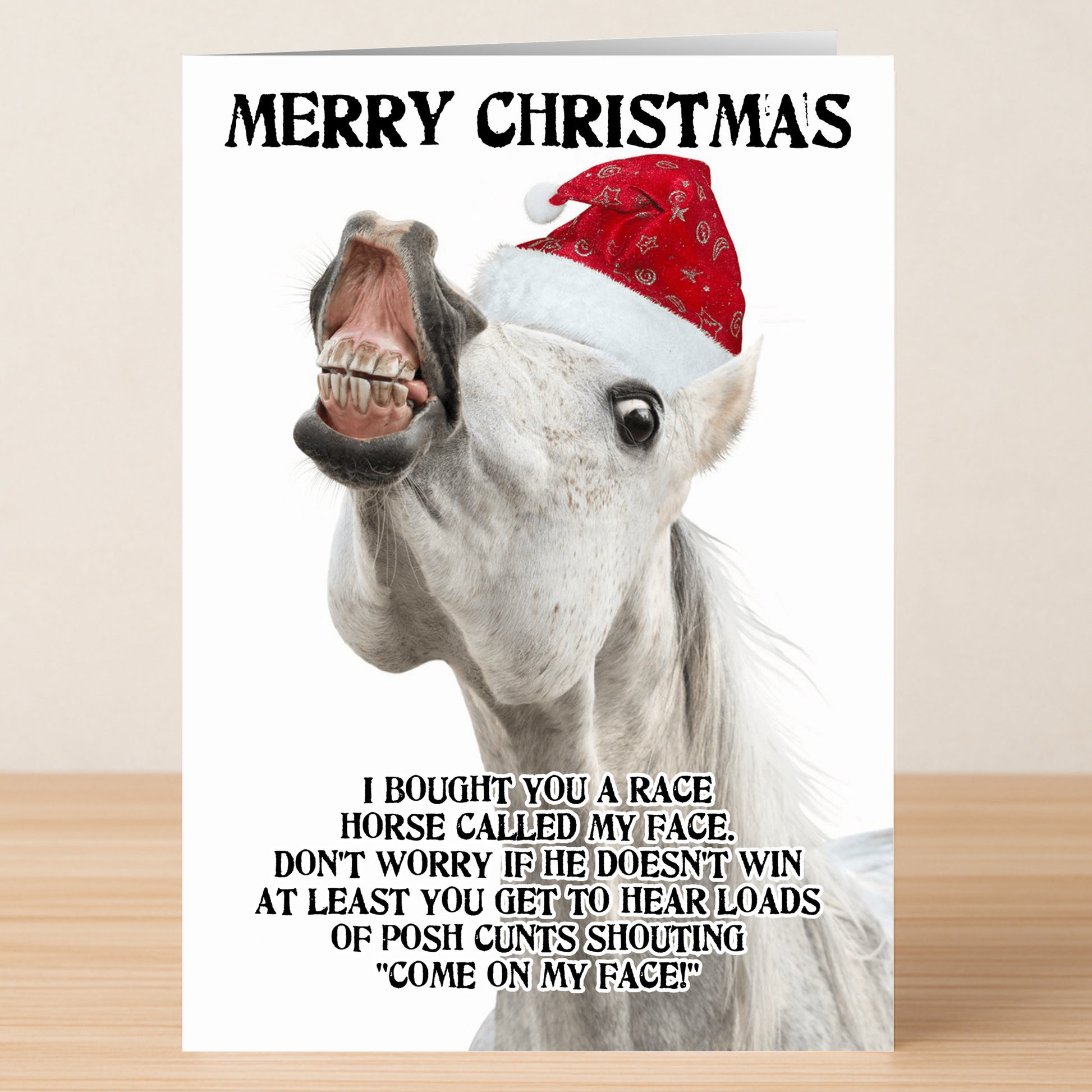 The Twisted Gifts My Face Rude Christmas Card features a horse in a Santa hat with explicit text, serving up laughs and bold holiday wishes for a truly memorable "Merry Christmas.