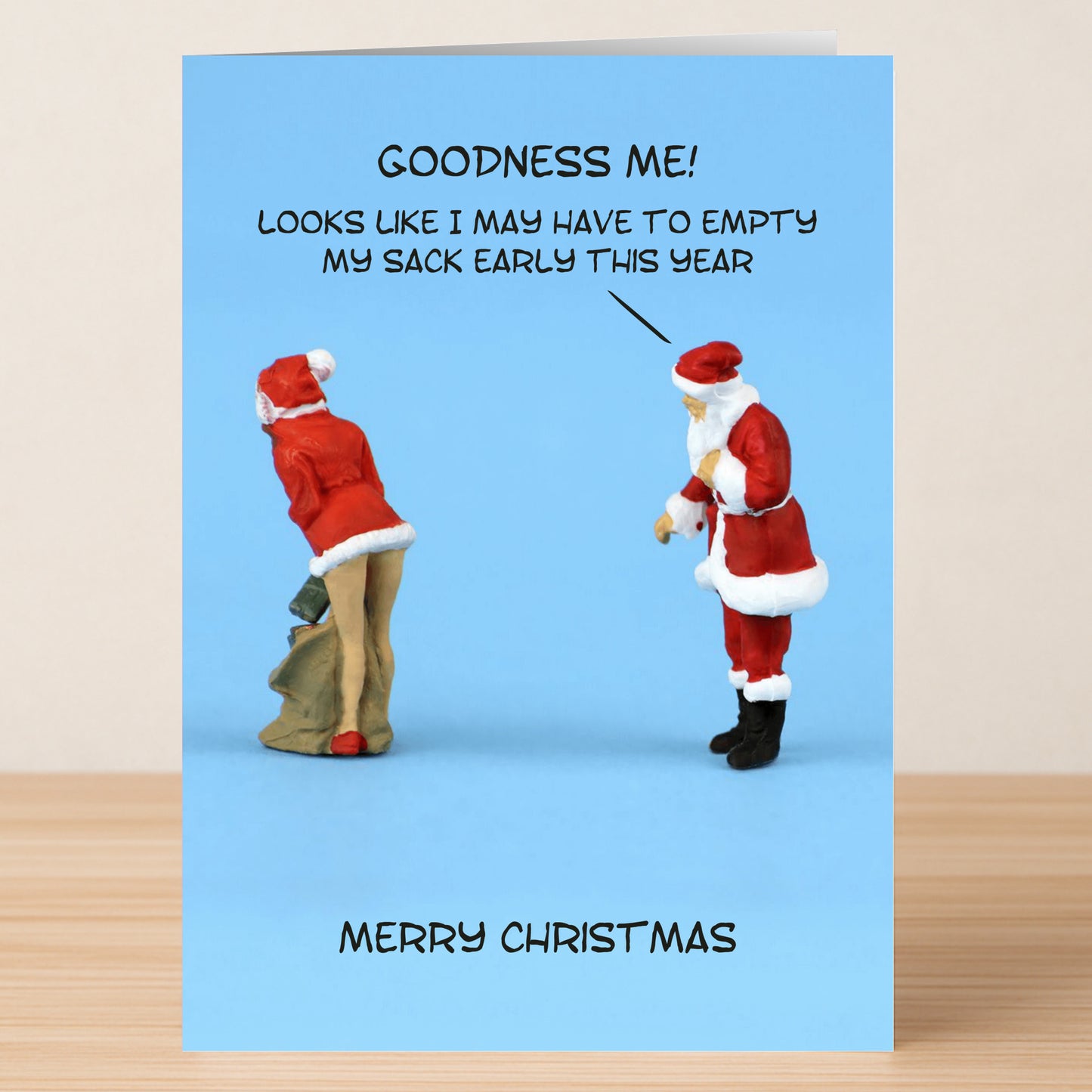 The Early Rude Christmas Card by Twisted Gifts features Santa ogling a woman in a Santa outfit with the cheeky caption, "Goodness me! Looks like I may have to empty my sack early this year." A funny holiday card!.