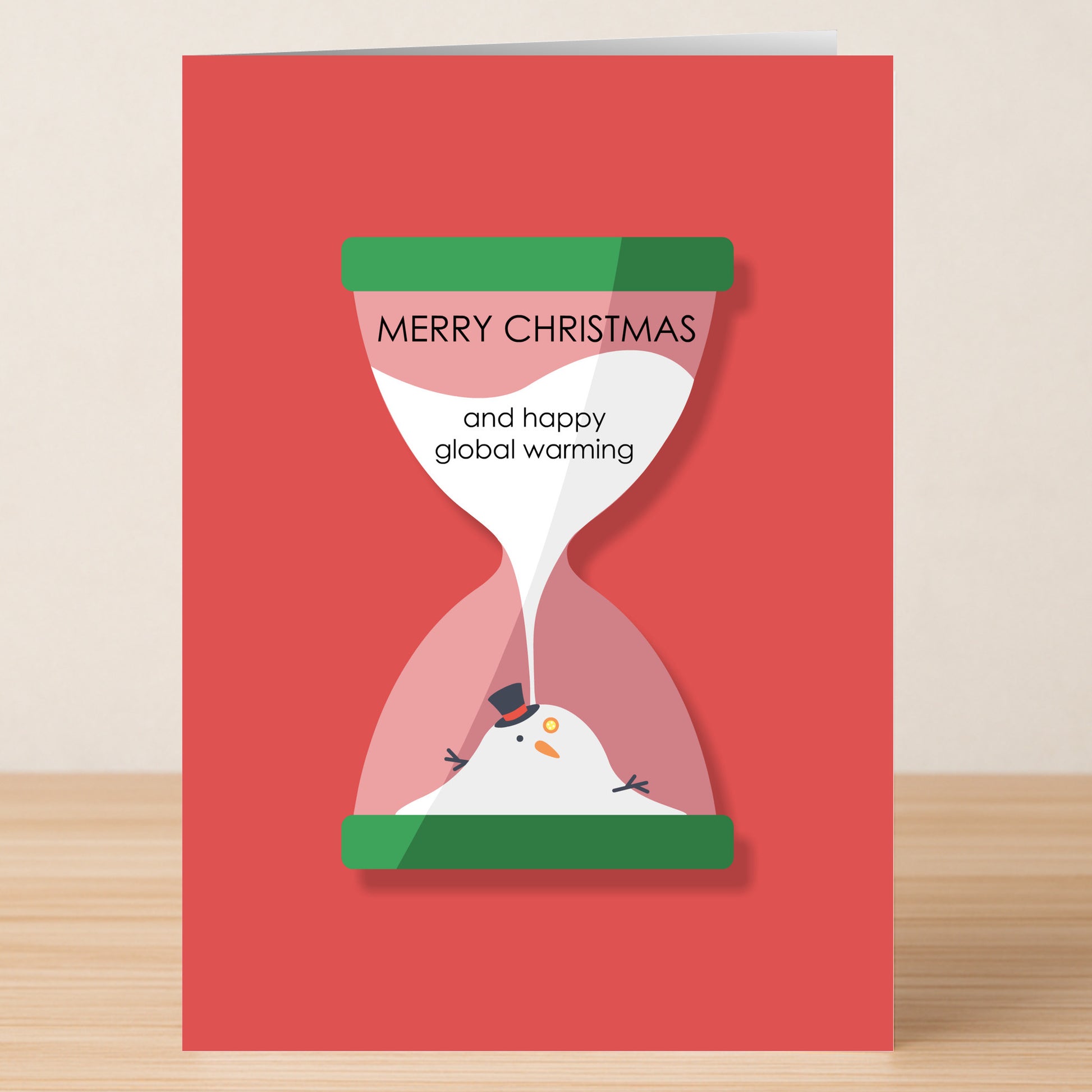 The Global Warming Funny Christmas Card by Twisted Gifts features a melting snowman in an hourglass and "Merry Christmas and happy global warming" text on red—a quirky choice for holiday greetings.