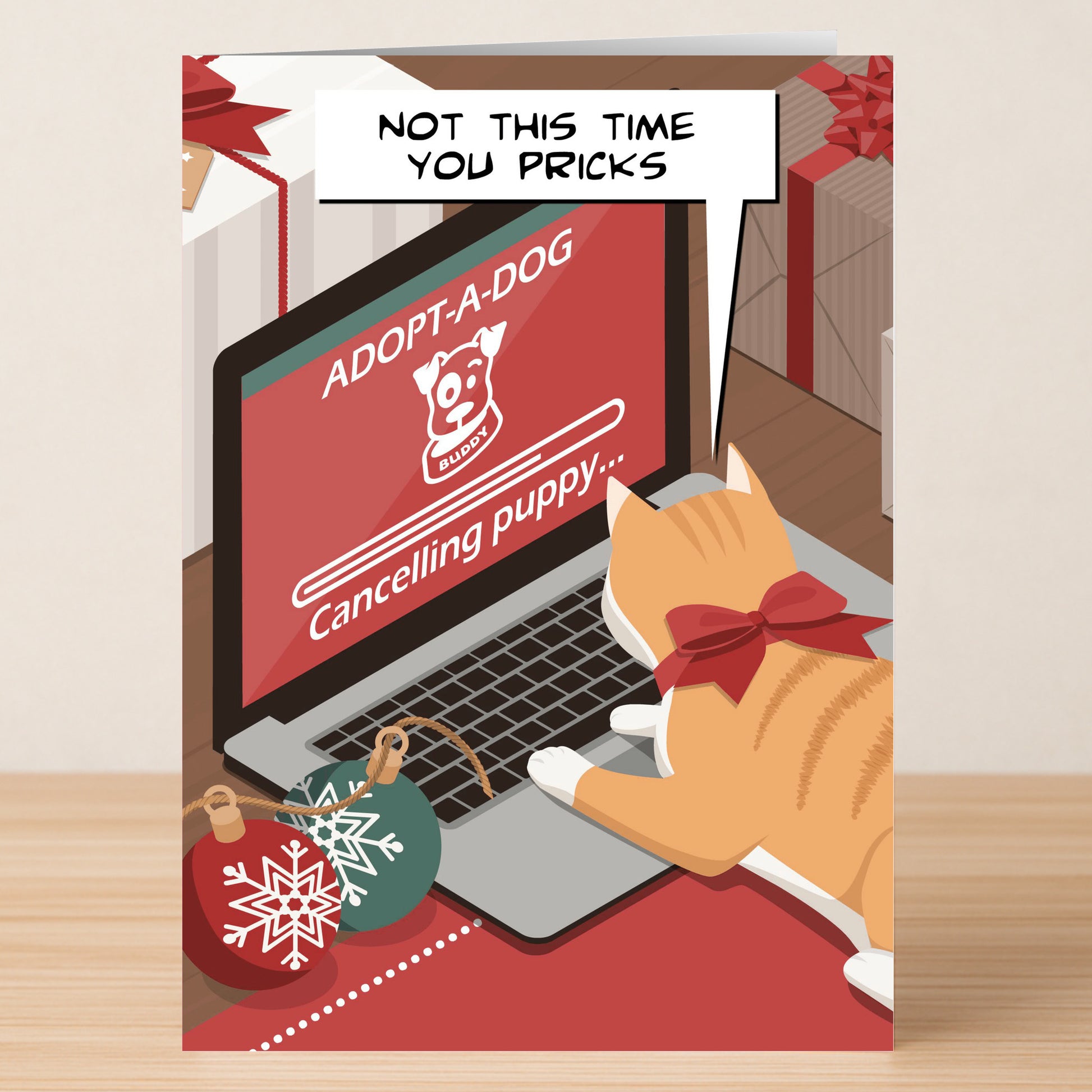 The Not This Time Funny Christmas Card by Twisted Gifts features a cat with a red bow typing on a laptop that reads "ADOPT-A-DOG Cancelling puppy...," surrounded by holiday ornaments and a gift for cheeky holiday fun. Speech bubble: "NOT THIS TIME YOU PRICKS.