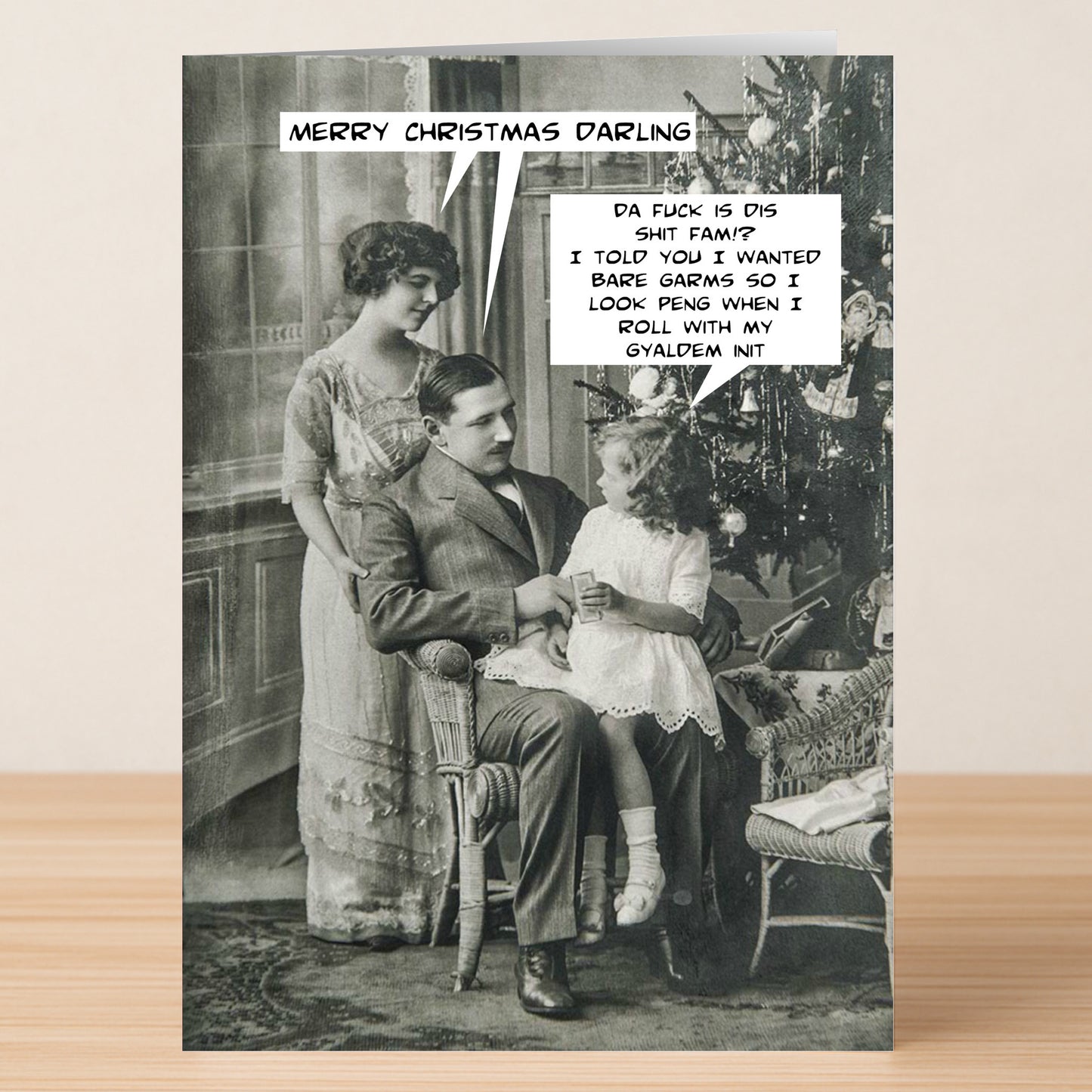 Featuring a vintage family Christmas photo with comic speech bubbles and playful slang, the Gyaldem Funny Christmas Card by Twisted Gifts is the perfect cheerful, unique choice for holiday laughs this season.