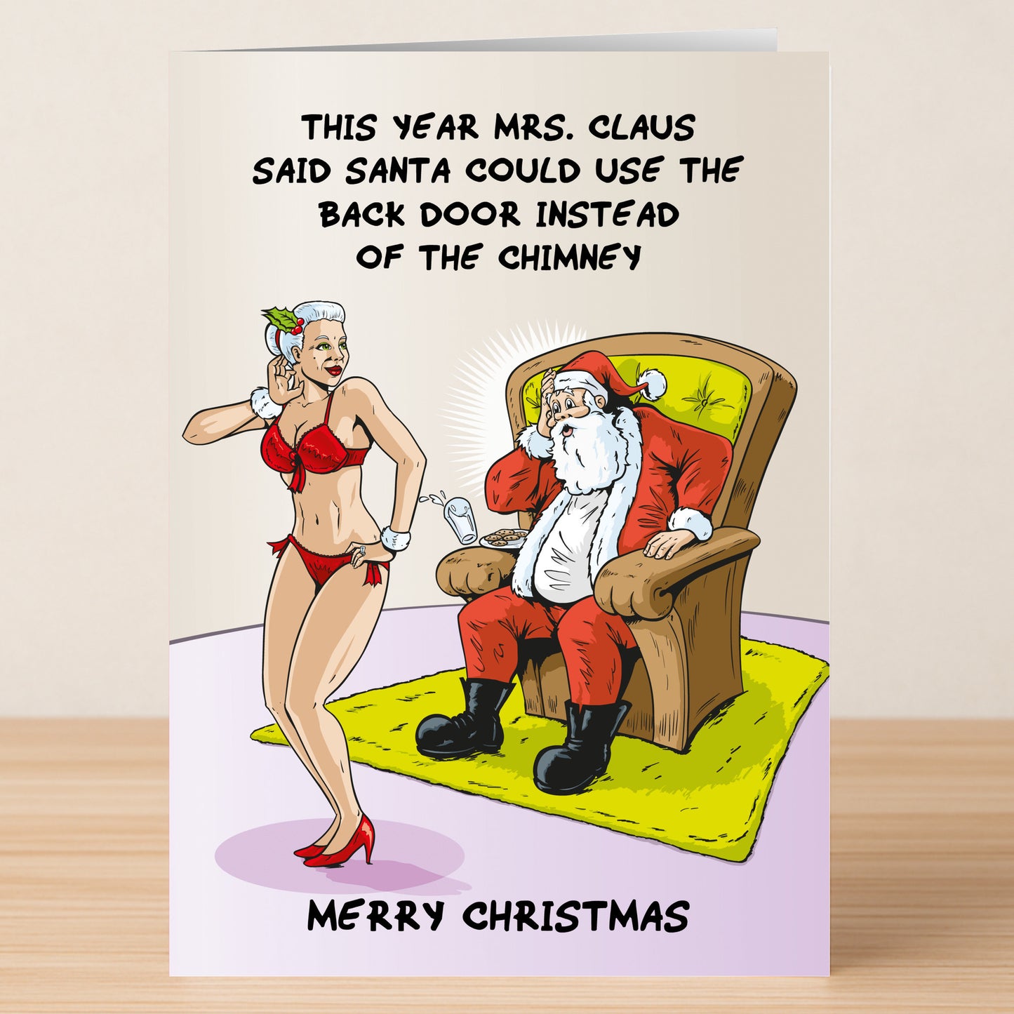 The Back Door Rude Christmas Card by Twisted Gifts features a cartoon Mrs. Claus in lingerie winking at a shocked Santa, with the text: "This year Mrs. Claus said Santa could use the back door instead of the chimney." Professionally printed.