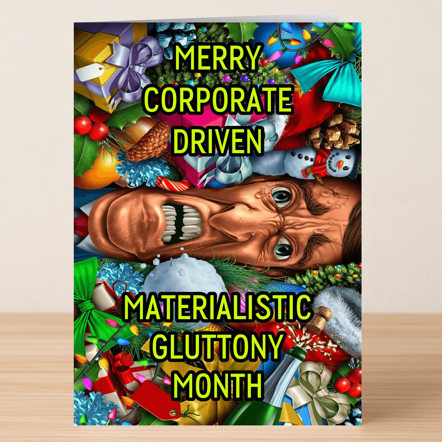 The Corporate Funny Christmas Card from Twisted Gifts features a colorful holiday collage with an angry face and the text "Merry Corporate Driven Materialistic Gluttony Month"—a hilarious twist for your holiday greetings.