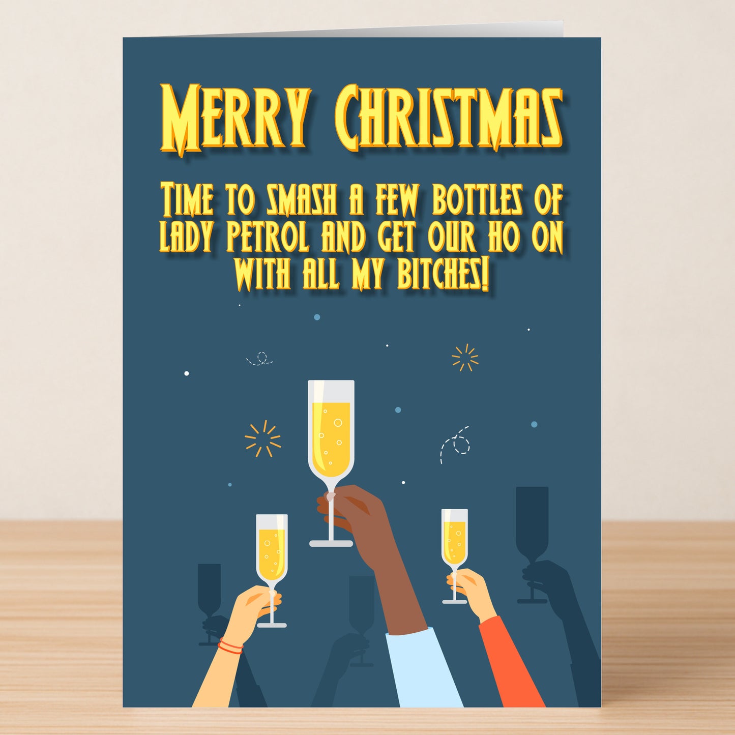 Twisted Gifts' Lady Petrol Funny Christmas Card: "Merry Christmas. Time to smash a few bottles of lady petrol and get our ho on with all my bitches!"—features hands raising champagne glasses for festive cheer!.