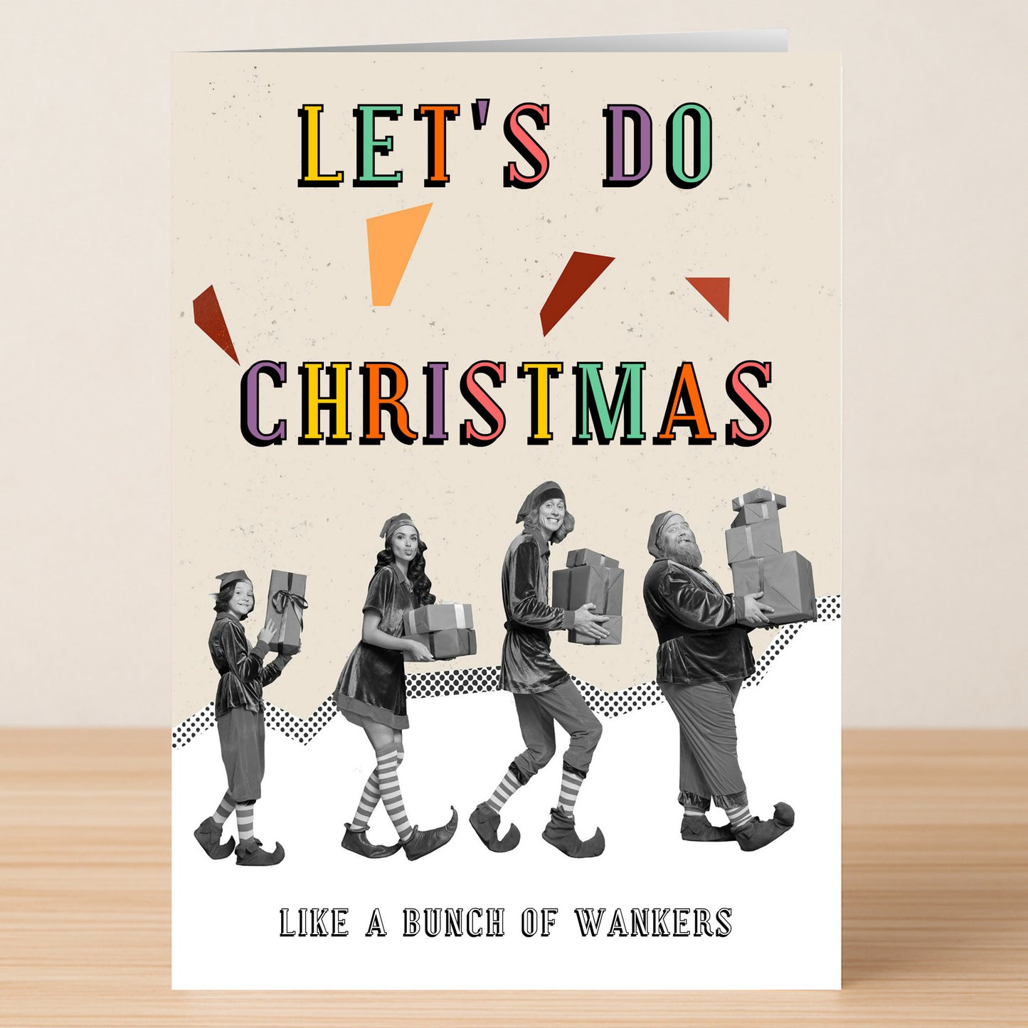 The Christmas Bunch Funny Christmas Card by Twisted Gifts features four elves with gifts and the phrase "LET'S DO CHRISTMAS LIKE A BUNCH OF WANKERS" in bold colors—a hilarious holiday card for festive fun.