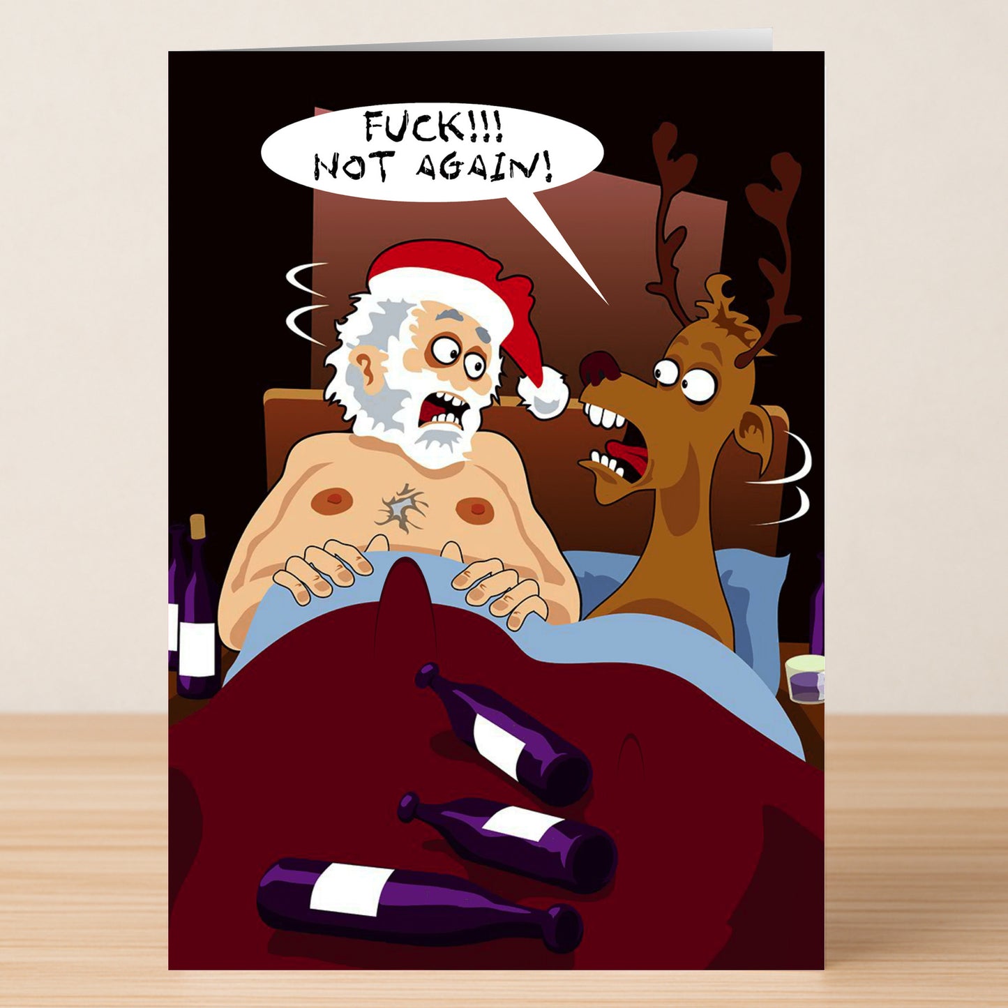 The Not Again Rude Christmas Card by Twisted Gifts features a cartoon Santa and reindeer in bed with empty bottles, with Santa exclaiming, "FUCK!!! NOT AGAIN!"—a hilarious holiday card for anyone who appreciates cheeky humor.