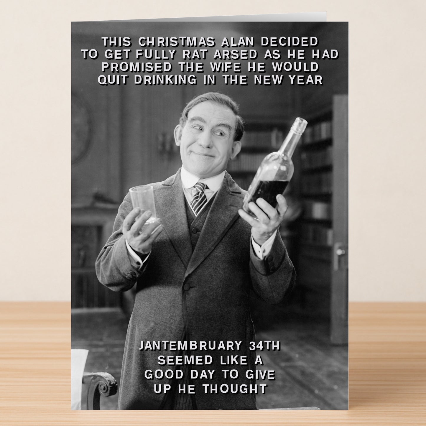 The Jantembruary Funny Christmas Card by Twisted Gifts features a man in a suit celebrating “Jantembruary 34th” with a drink—perfect for sharing laughs about failed New Year’s resolutions this holiday season.