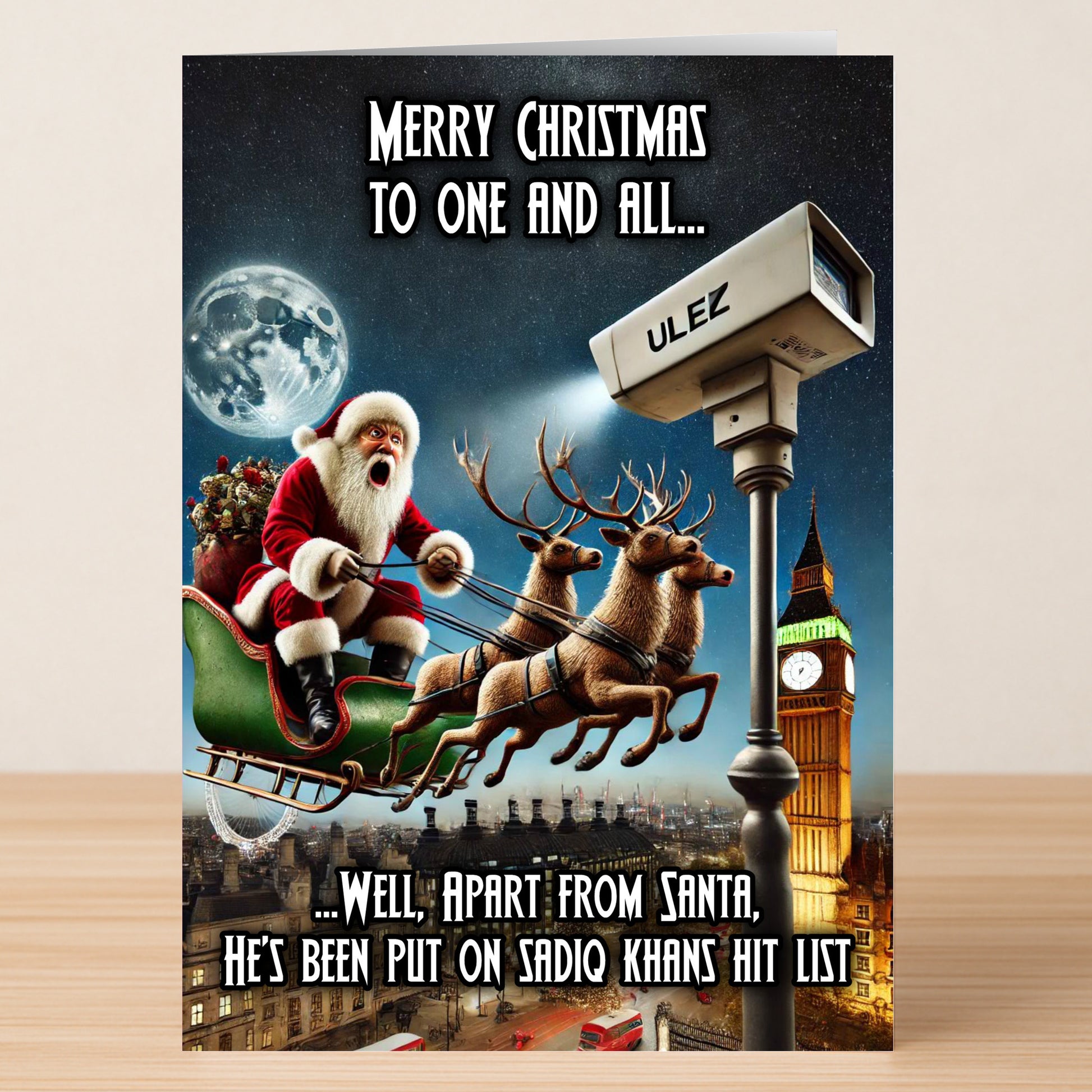The Twisted Gifts ULEZ Funny Christmas Card shows Santa flying over London with Big Ben and a giant ULEZ camera, cleverly poking fun at Sadiq Khan’s festive hit list.