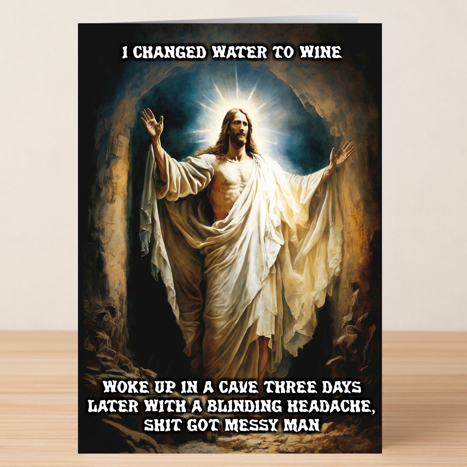 The Three Days Funny Christmas Card by Twisted Gifts features Jesus in flowing robes and a witty miracle-themed caption about waking up with a headache—perfect for spreading holiday cheer this festive season.