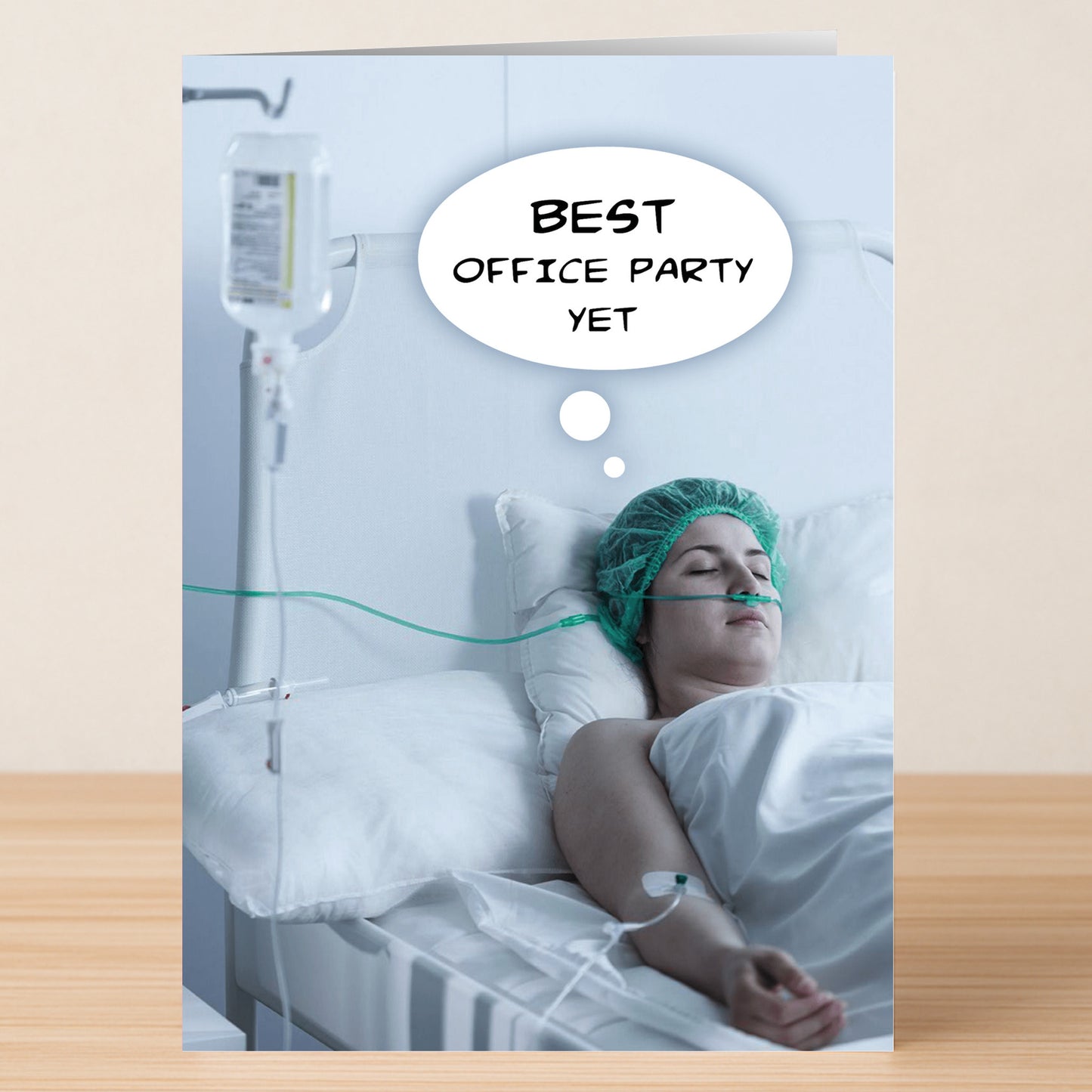 The Best Yet Funny Christmas Card by Twisted Gifts features a hospital patient dreaming, "Best office party yet." Bring unexpected holiday cheer with this hilarious card—perfect for anyone who loves a good laugh at Christmas!.