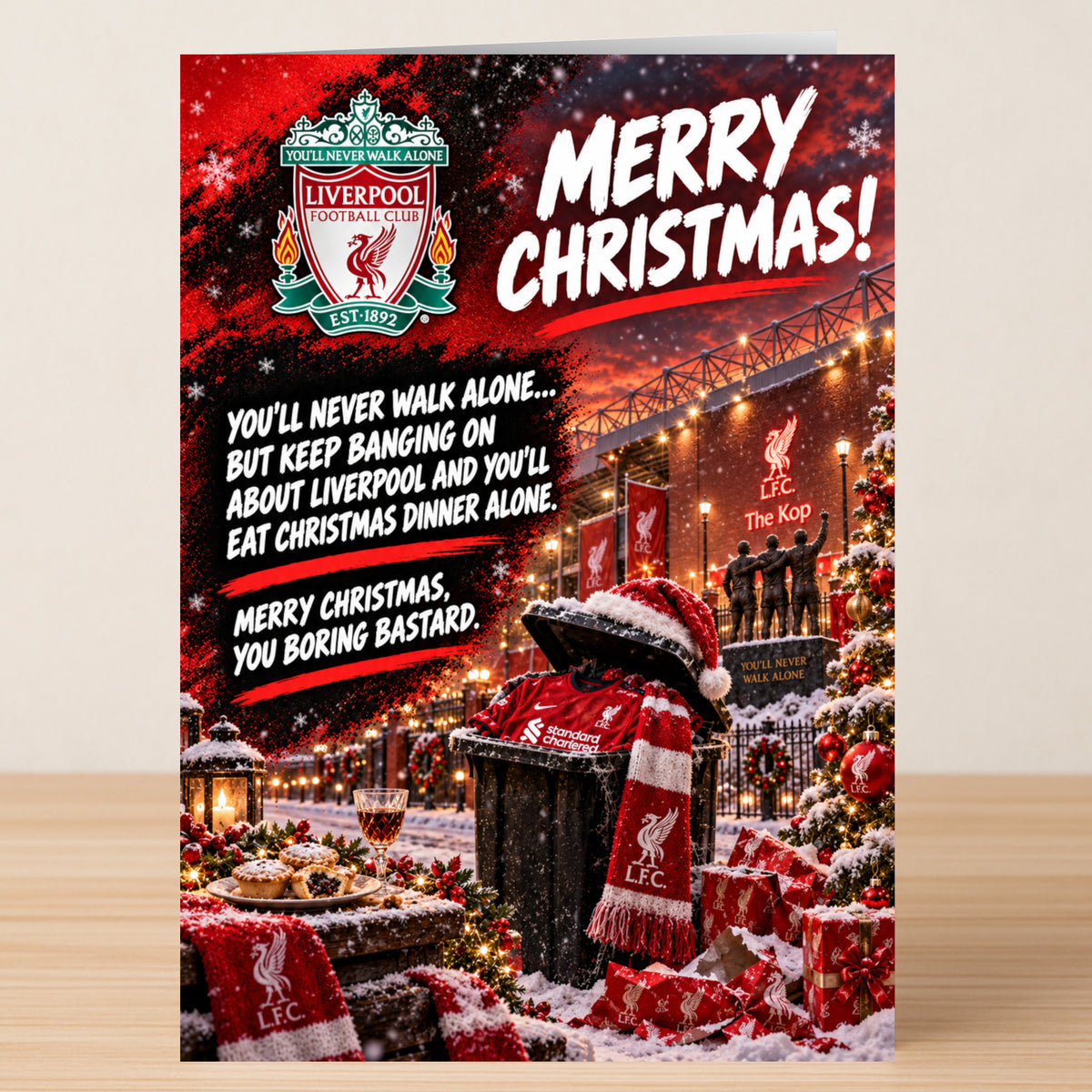 Twisted Gifts Liverpool – Funny Christmas Card featuring the Liverpool FC logo, stadium, and a garbage bin filled with a jersey and scarf, with the text: “Merry Christmas! You’ll never walk alone...”