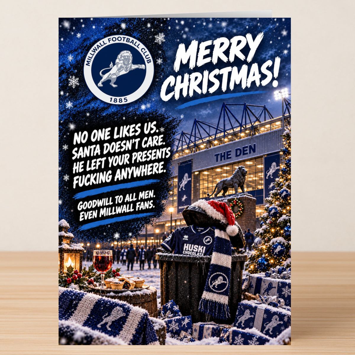 Millwall – Funny Christmas Card featuring the Millwall FC logo and stadium, with the text: “Merry Christmas! No one likes us. Santa doesn’t care. He left your presents fucking anywhere.”