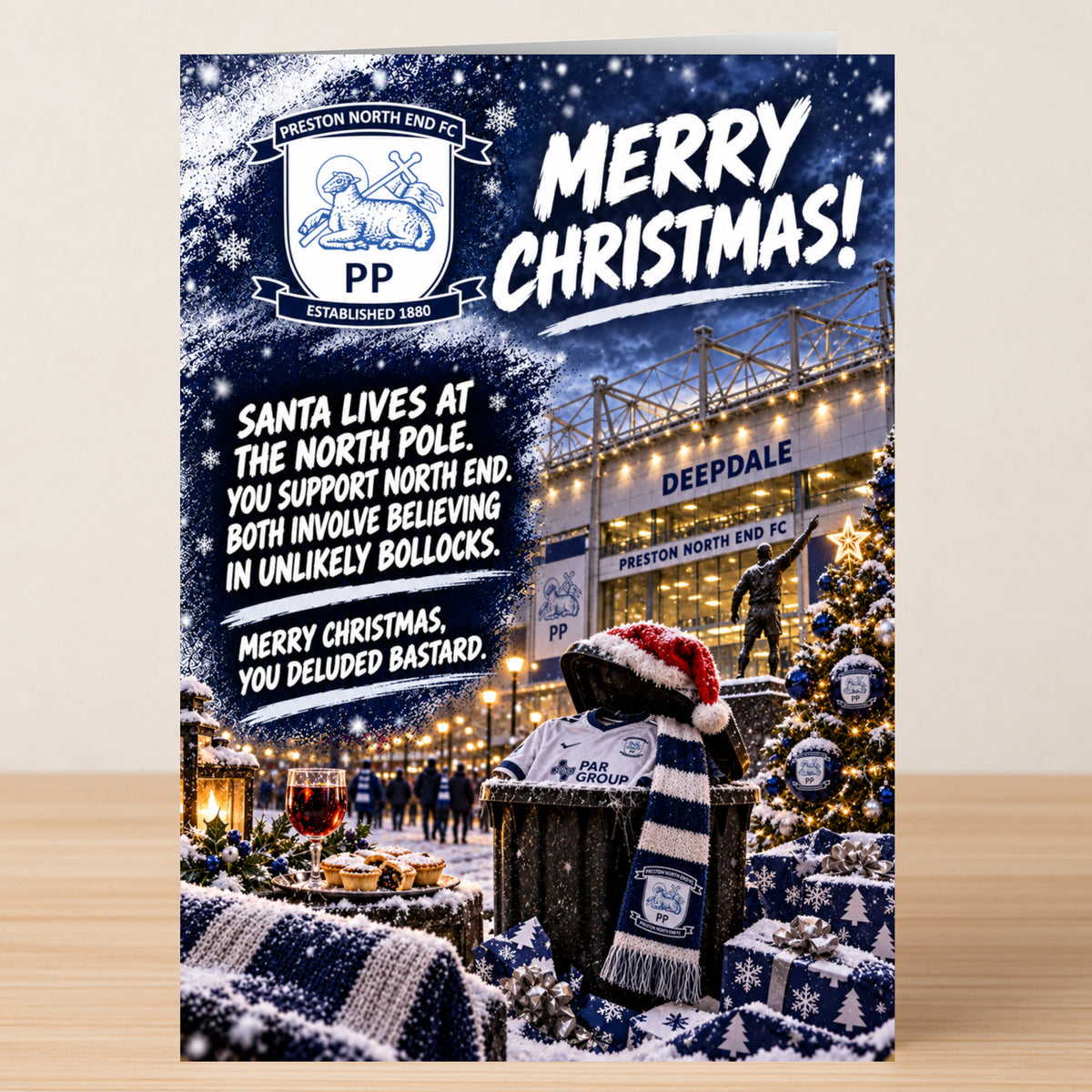 A Preston North End – Funny Christmas Card featuring the team logo and Deepdale stadium with text about believing in unlikely bollocks.