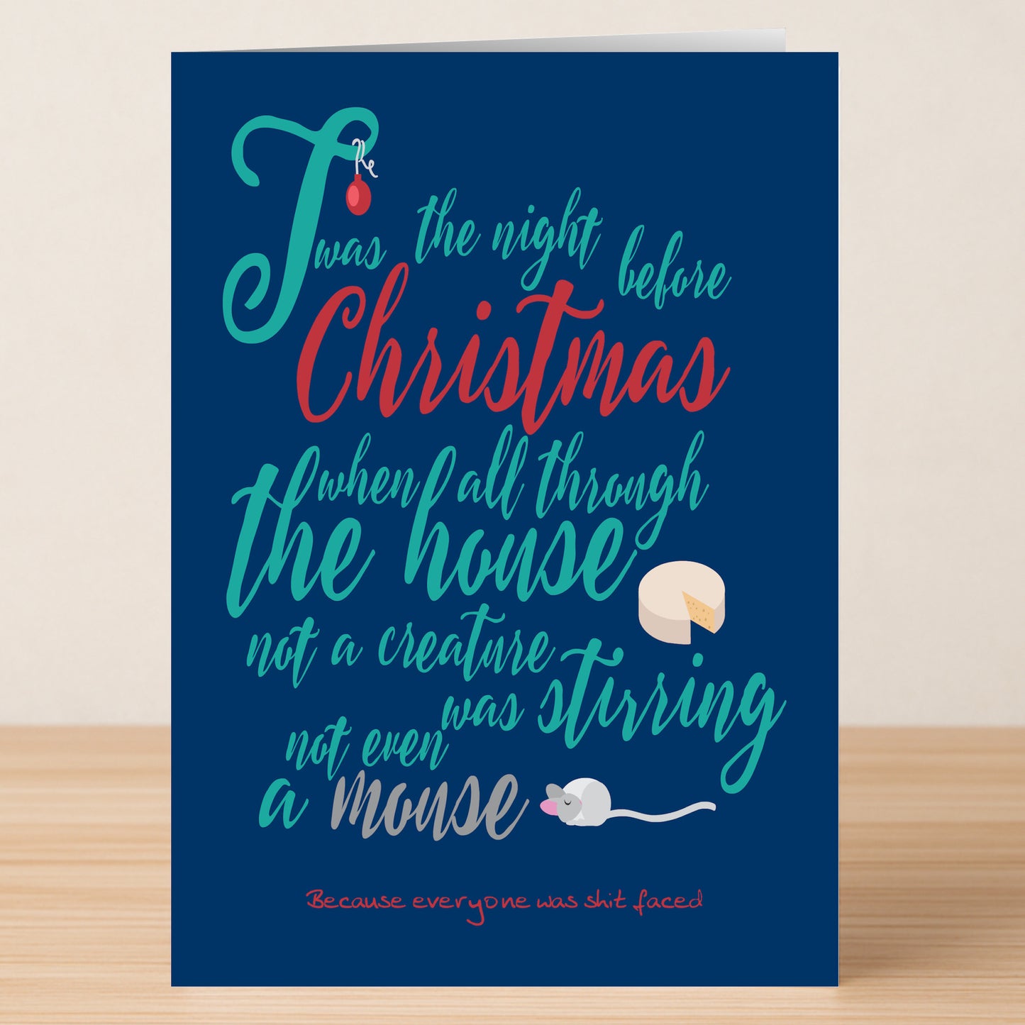 The Stirring Rude Christmas Card from Twisted Gifts features a cheeky mouse and cheese illustration with the phrase, “‘Twas the night before Christmas when all through the house not a creature was stirring, not even a mouse.”.