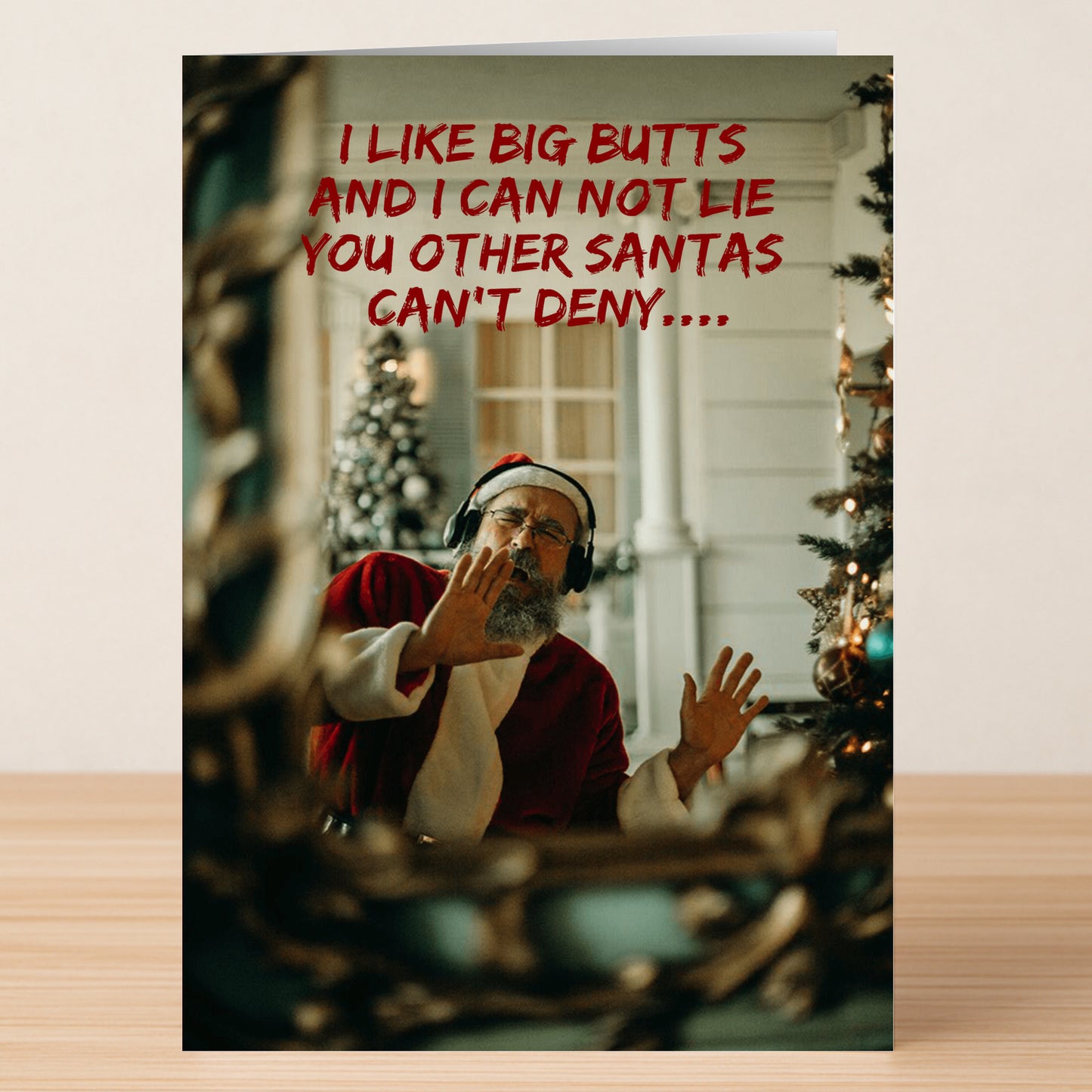 The Big Butts Rude Christmas Card by Twisted Gifts features Santa dancing in headphones by a tree with the text: "I LIKE BIG BUTTS AND I CAN NOT LIE YOU OTHER SANTAS CAN'T DENY....." A hilarious and cheeky holiday card.
