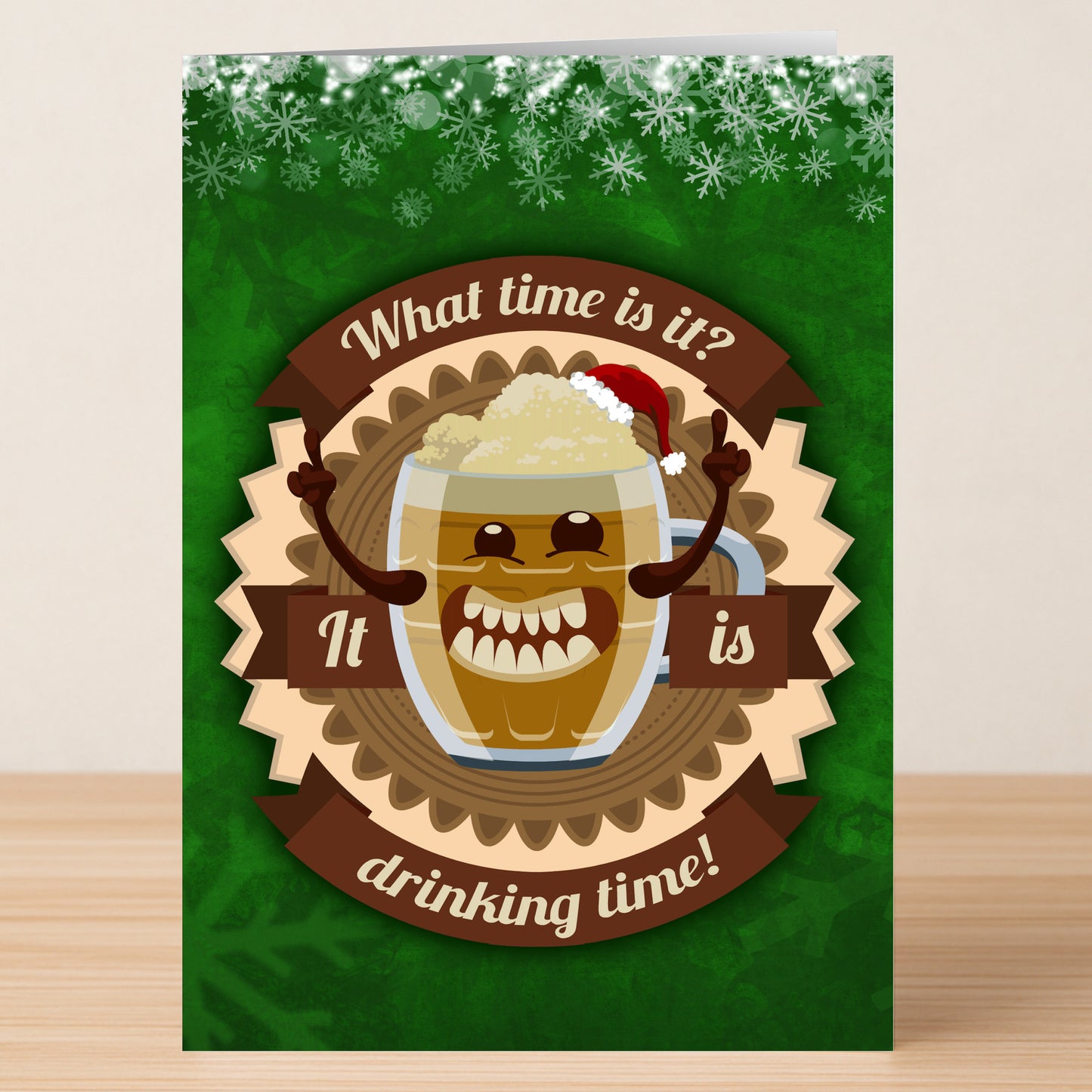 The Drinking Time Funny Christmas Card by Twisted Gifts features a smiling cartoon beer mug in a Santa hat with the message, "What time is it? It is drinking time!" on a green, snowflake background—perfect for holiday cheer.