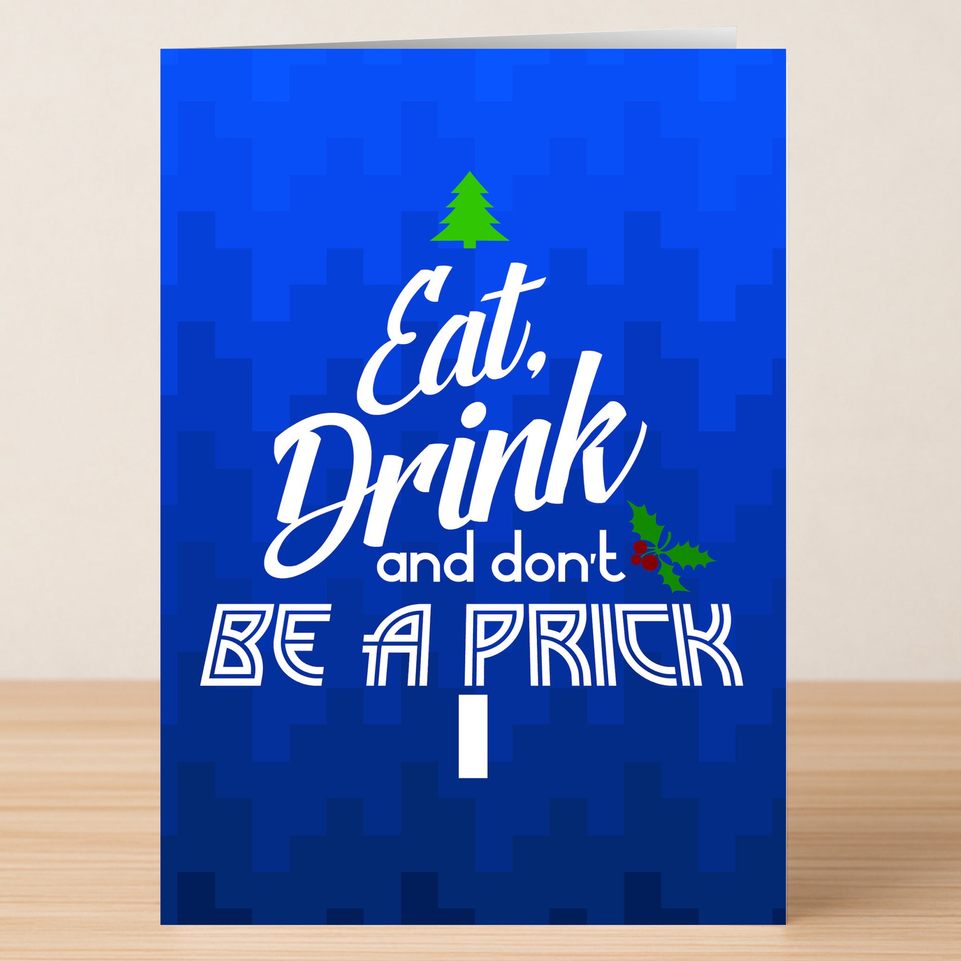 The Twisted Gifts Eat Drink Funny Christmas Card features "Eat, Drink and don't BE A PRICK" in white on blue, with a tree and holly design—perfect for spreading holiday cheer.