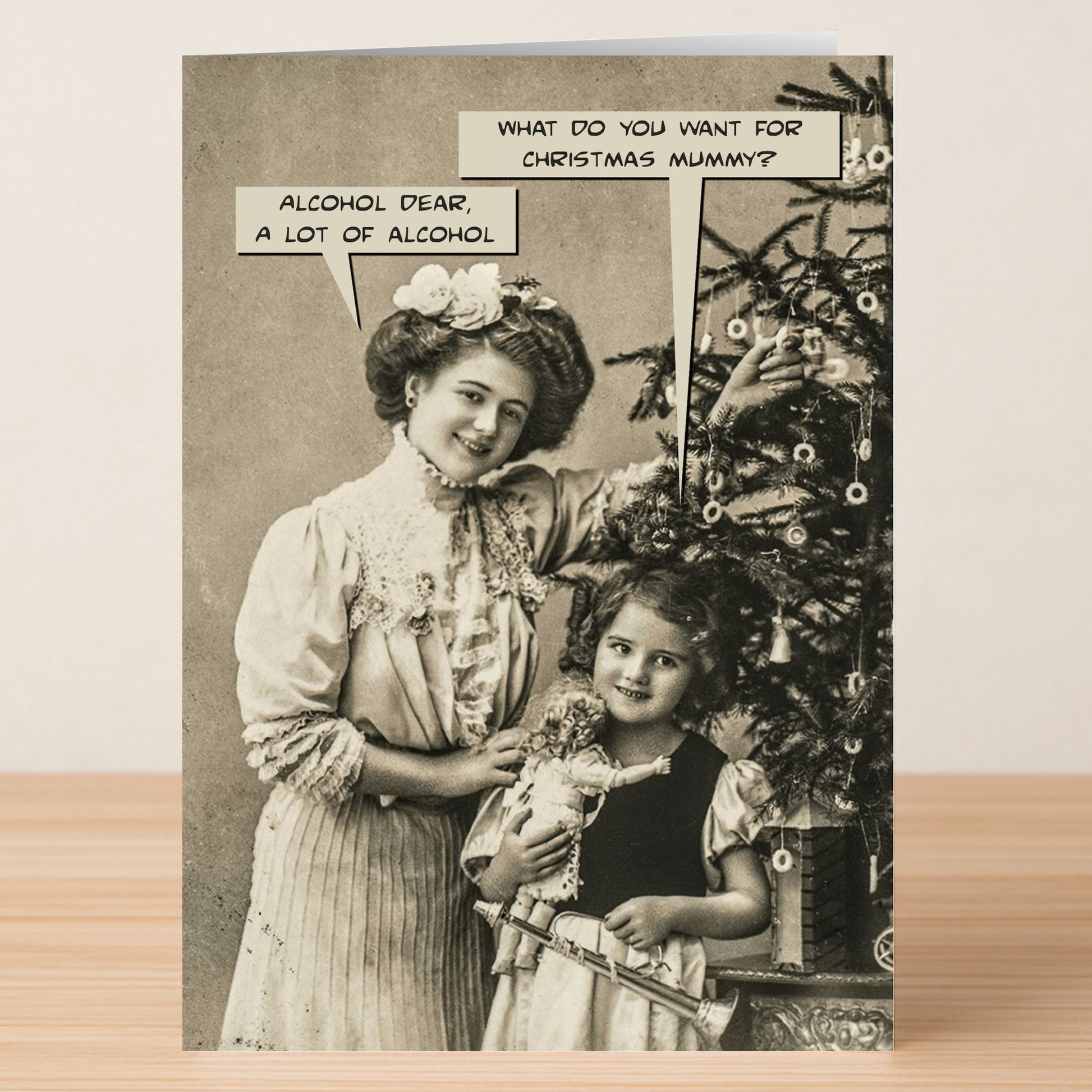 Alcohol Dear Funny Christmas Card by Twisted Gifts features a vintage woman and child at a Christmas tree with witty speech bubbles about gifts and alcohol—a hilarious card to bring holiday cheer!.