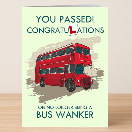 The Twisted Gifts Bus Wanker Insulting Congratulations Card humorously celebrates passing the driving test, featuring a red double-decker bus and the cheeky “bus wanker” joke.