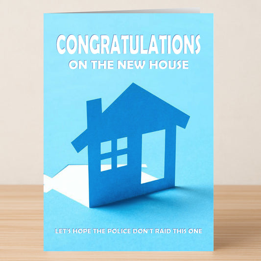 Twisted Gifts' Raid Funny Congratulations Card features a blue paper house cutout with the message: "Congratulations on the new house. Let's hope the police don't raid this one," printed in crisp white text.
