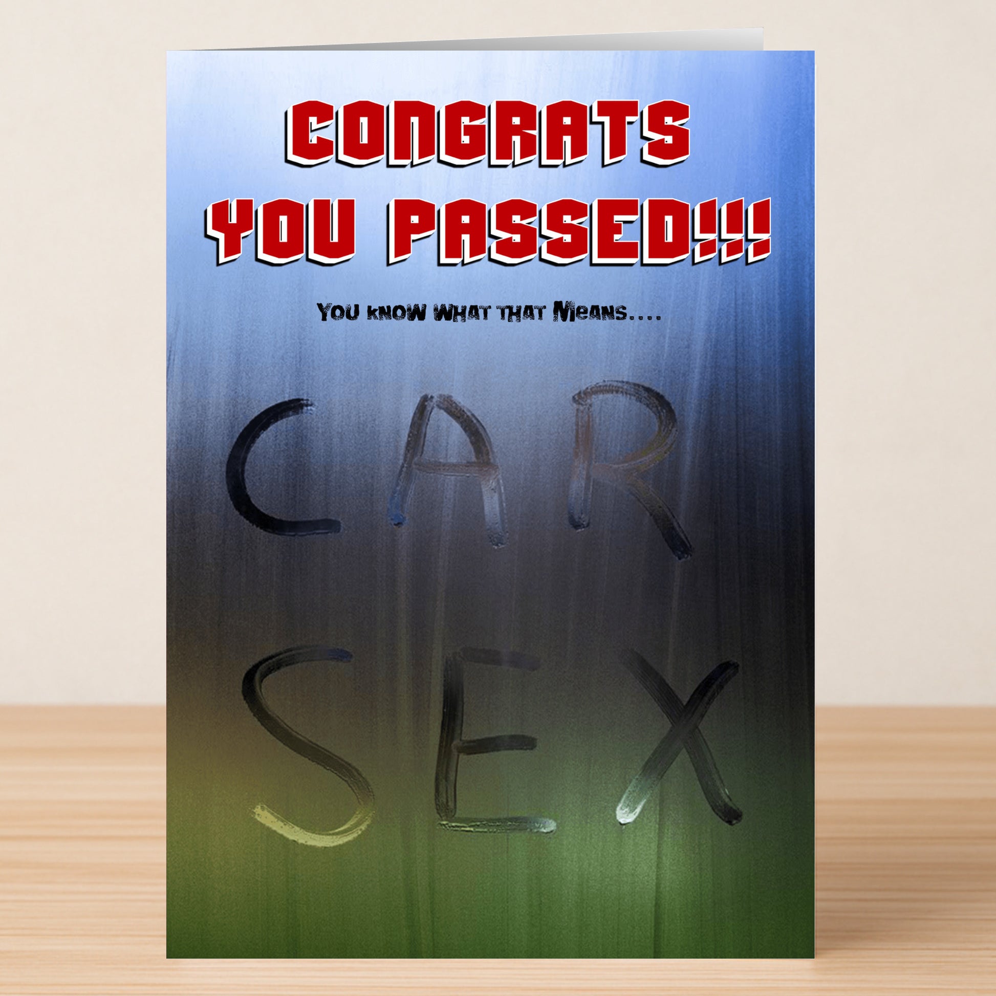 Celebrate with the Twisted Gifts Car Sex Rude Congratulations Card, featuring "Congrats You Passed!!!" in red and a playful "CAR SEX" message on a foggy window background. Perfect for cheeky humor!.