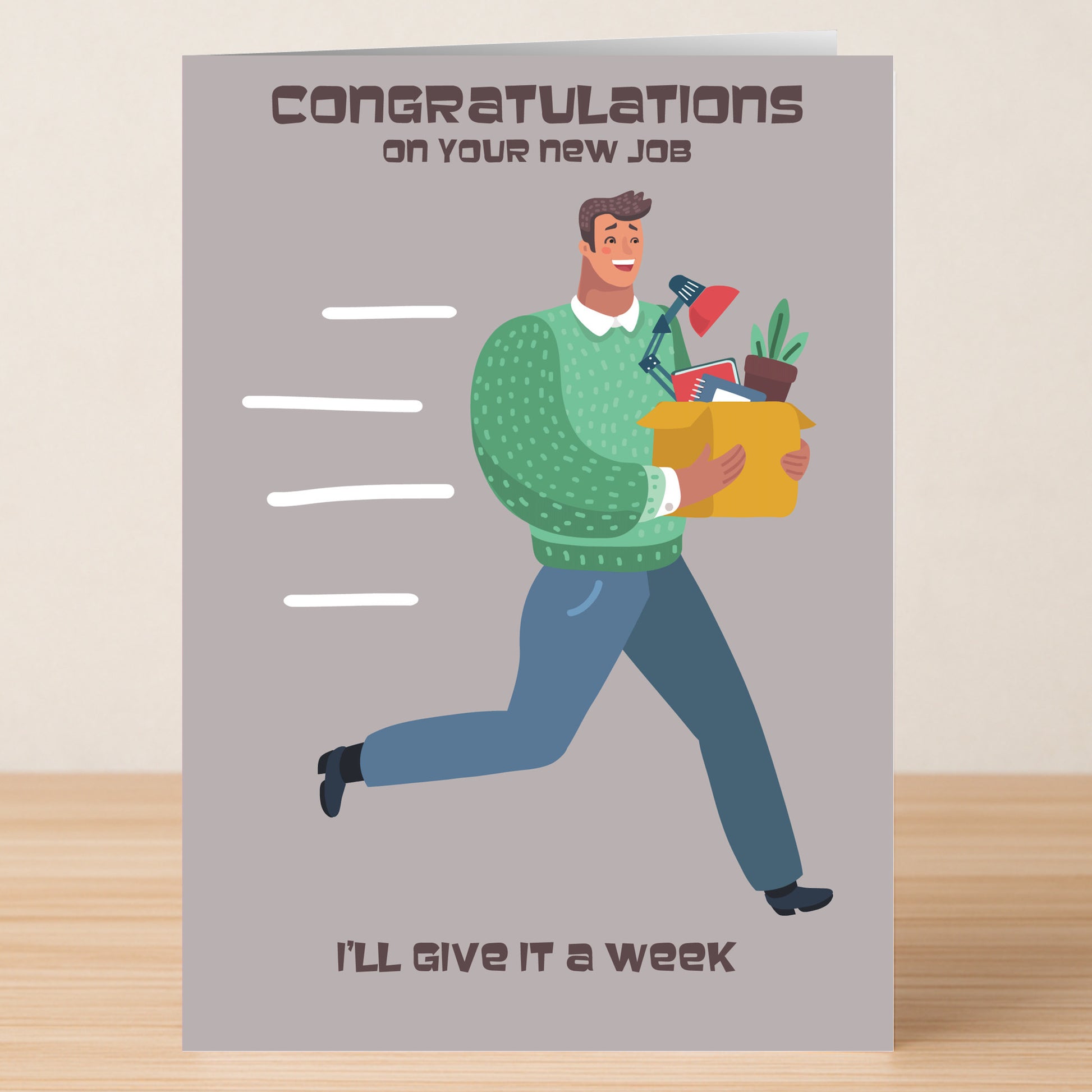The New Job Funny Congratulations Card by Twisted Gifts features a smiling man running with office items and the message: "Congratulations on your new job. I’ll give it a week.