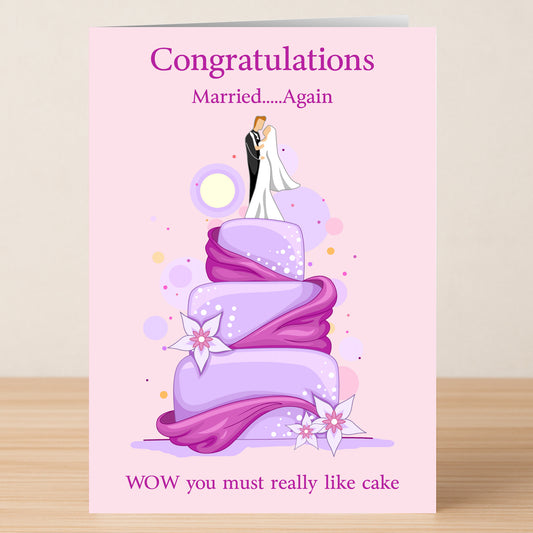 The Married Again Insulting Congratulations Card by Twisted Gifts features a cartoon couple on a purple wedding cake with the text: "Congratulations Married...Again WOW you must really like cake." Perfect for second weddings and those who love humor!.