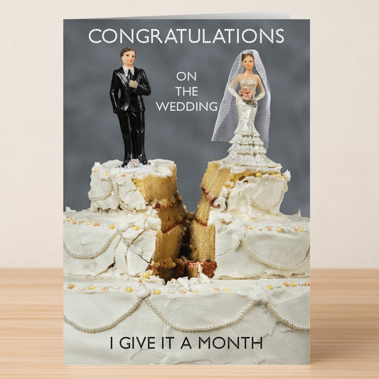 The "A Month Funny Congratulations Card" by Twisted Gifts features bride and groom figurines on a split wedding cake with the message: "Congratulations on the wedding. I give it a month.