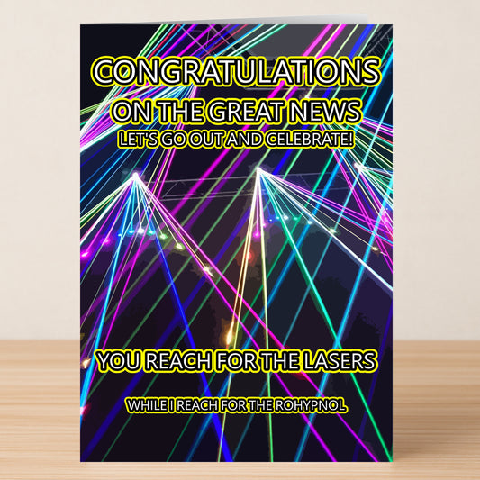 Celebrate in style with Twisted Gifts' Reach For The Lasers Rude Congratulations Card—a humorous, quirky card featuring colorful lasers and bold yellow text, perfect for sending playful congratulations.