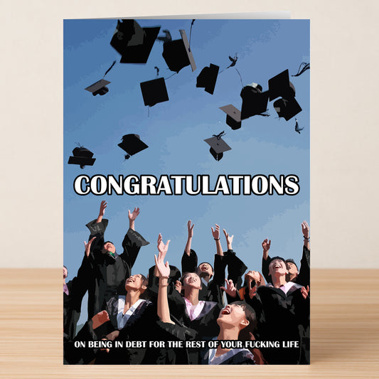 The Debt Funny Congratulations Card by Twisted Gifts features graduates tossing caps and the message: "CONGRATULATIONS On being in debt for the rest of your fucking life.