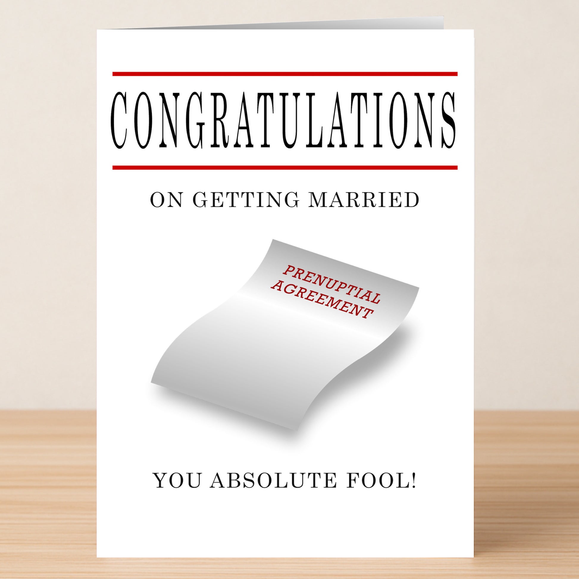 The Prenup Rude Congratulations Card from Twisted Gifts features “CONGRATULATIONS ON GETTING MARRIED YOU ABSOLUTE FOOL!” plus a prenuptial agreement on the front for a truly sarcastic twist.