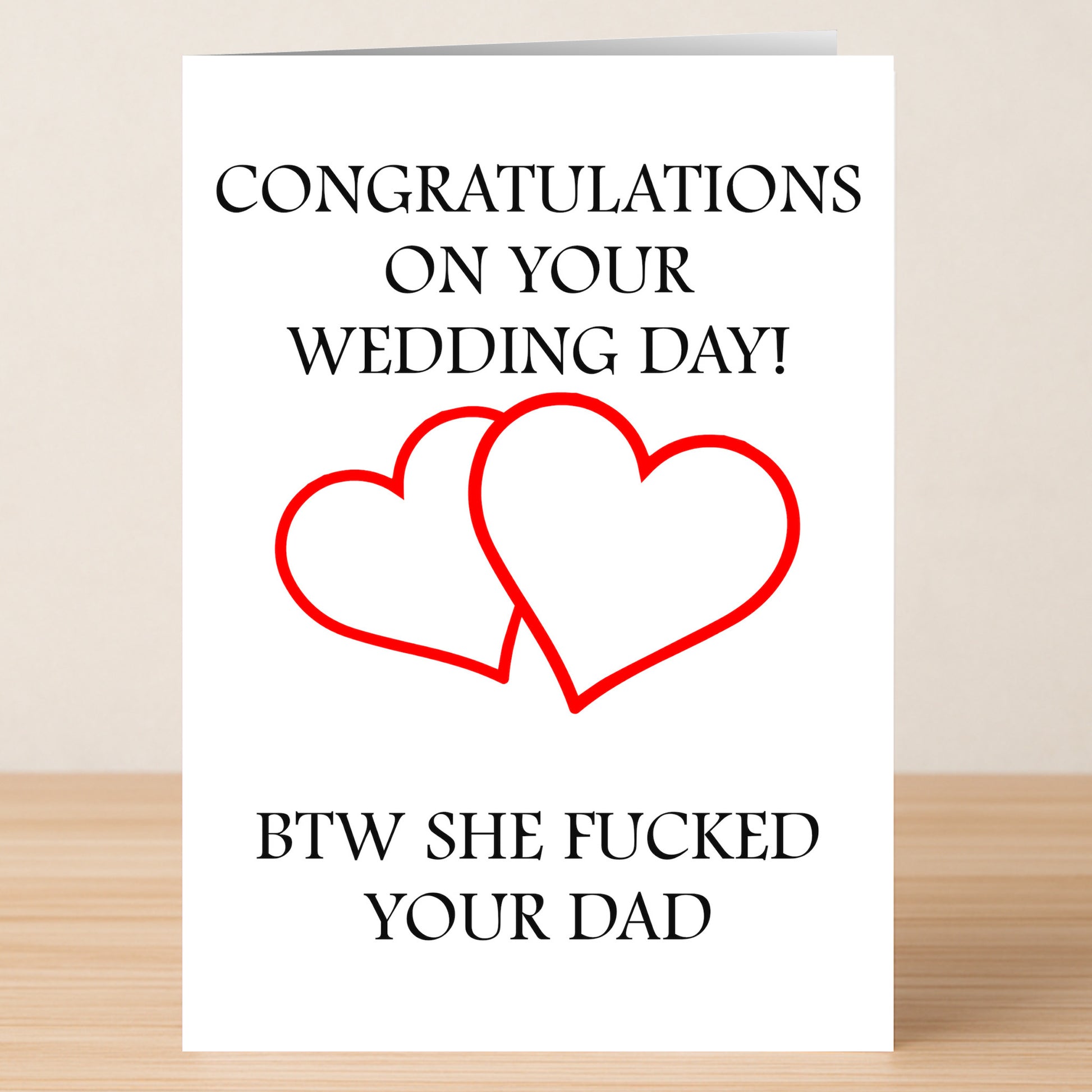 The His Wedding Day Rude Congratulations Card by Twisted Gifts features two red outlined hearts and a cheeky message, perfect for anyone who appreciates an edgy sense of humor on a wedding day.