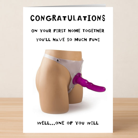 Twisted Gifts’ First Home Rude Congratulations Card is a cheeky way to celebrate a couple’s milestone, featuring an unforgettable mannequin with a strap-on dildo for plenty of laughs.