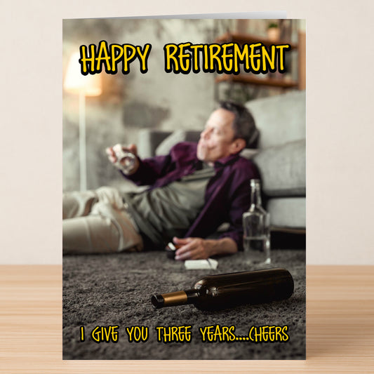 A man lounges on a carpeted floor with a drink and empty bottles nearby. Text: "Happy Retirement. I give you three years... Cheers." The Three Years Funny Congratulations Card by Twisted Gifts—a playful way to celebrate retirement!.