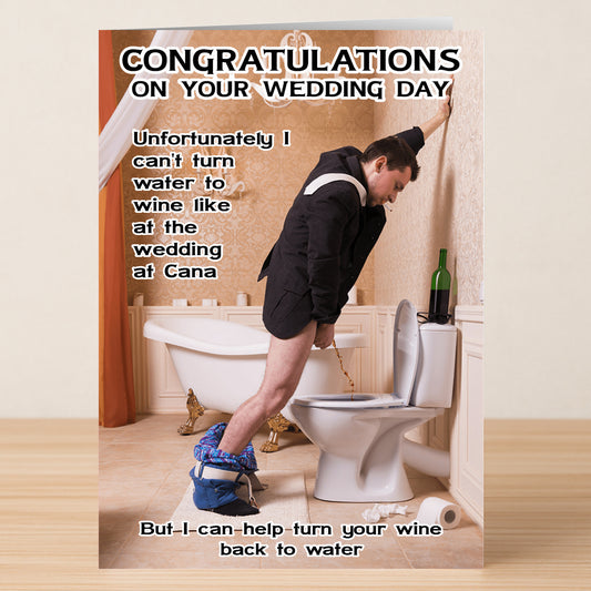 A man in a suit with pants down pours wine into a toilet—a classic “Wine To Water” scene—features humorous wedding congratulations on the Wine To Water Funny Congratulations Card by Twisted Gifts.